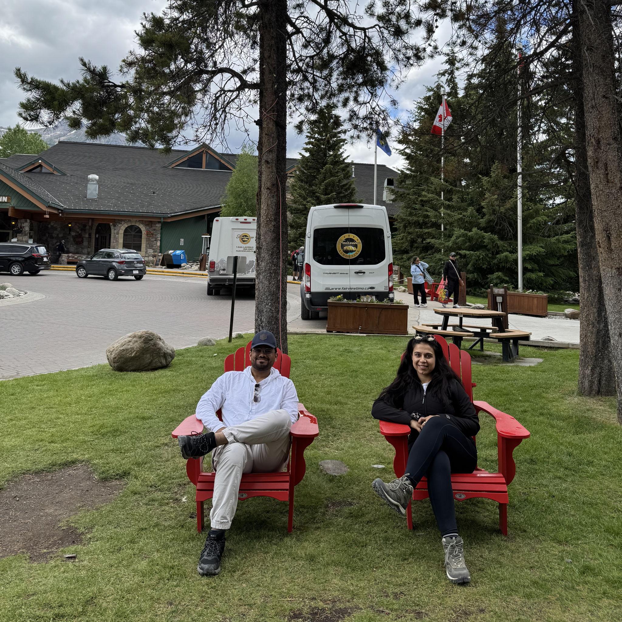 Pre‑Lake Moraine chill session: two red chairs, mountain air, and zero worries