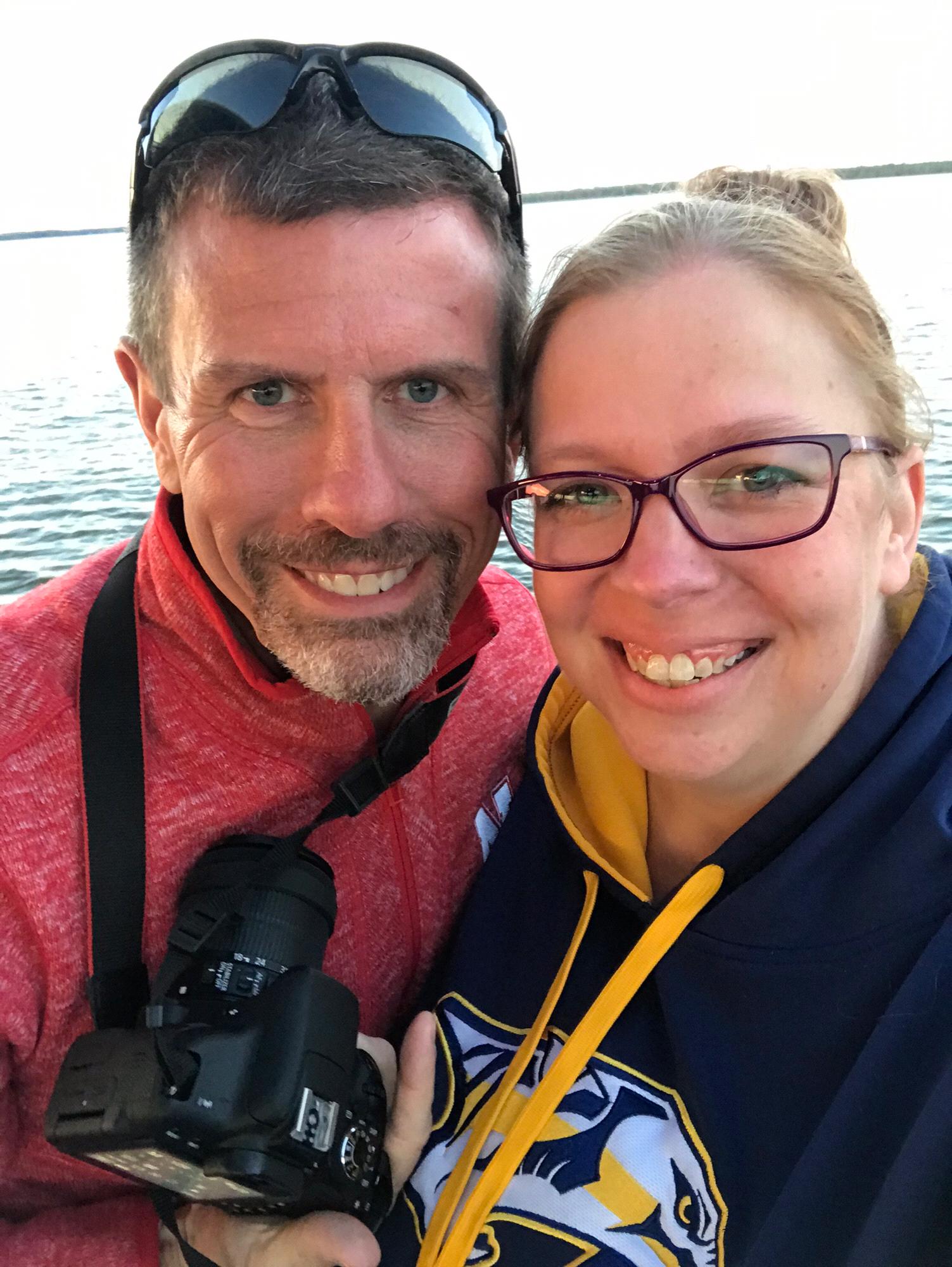 Newly engaged on a sunset dolphin cruise.