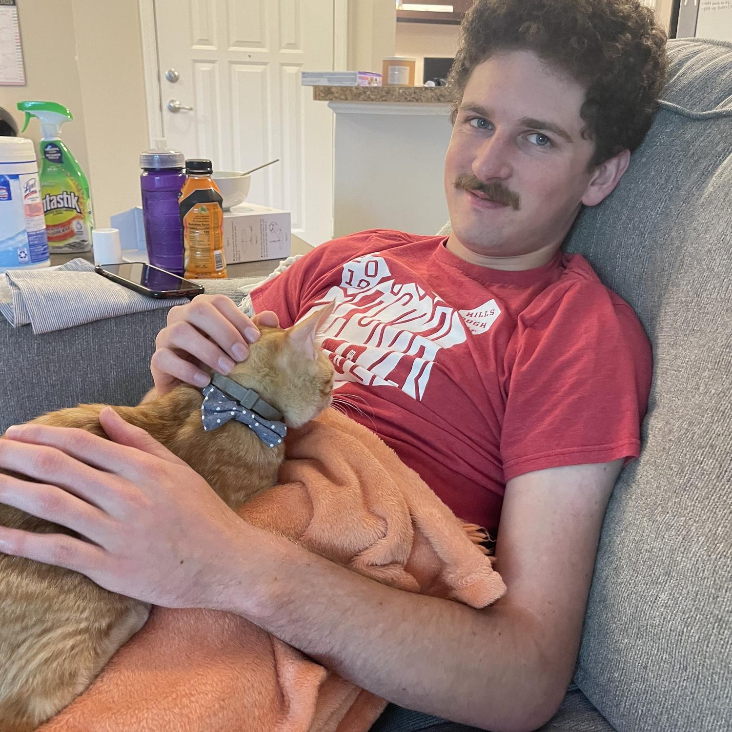 Abby convinced Alex to get a cat. They named him Taco after Alex’s Orange Tacoma Truck. They got another kitty named Seven a year later.