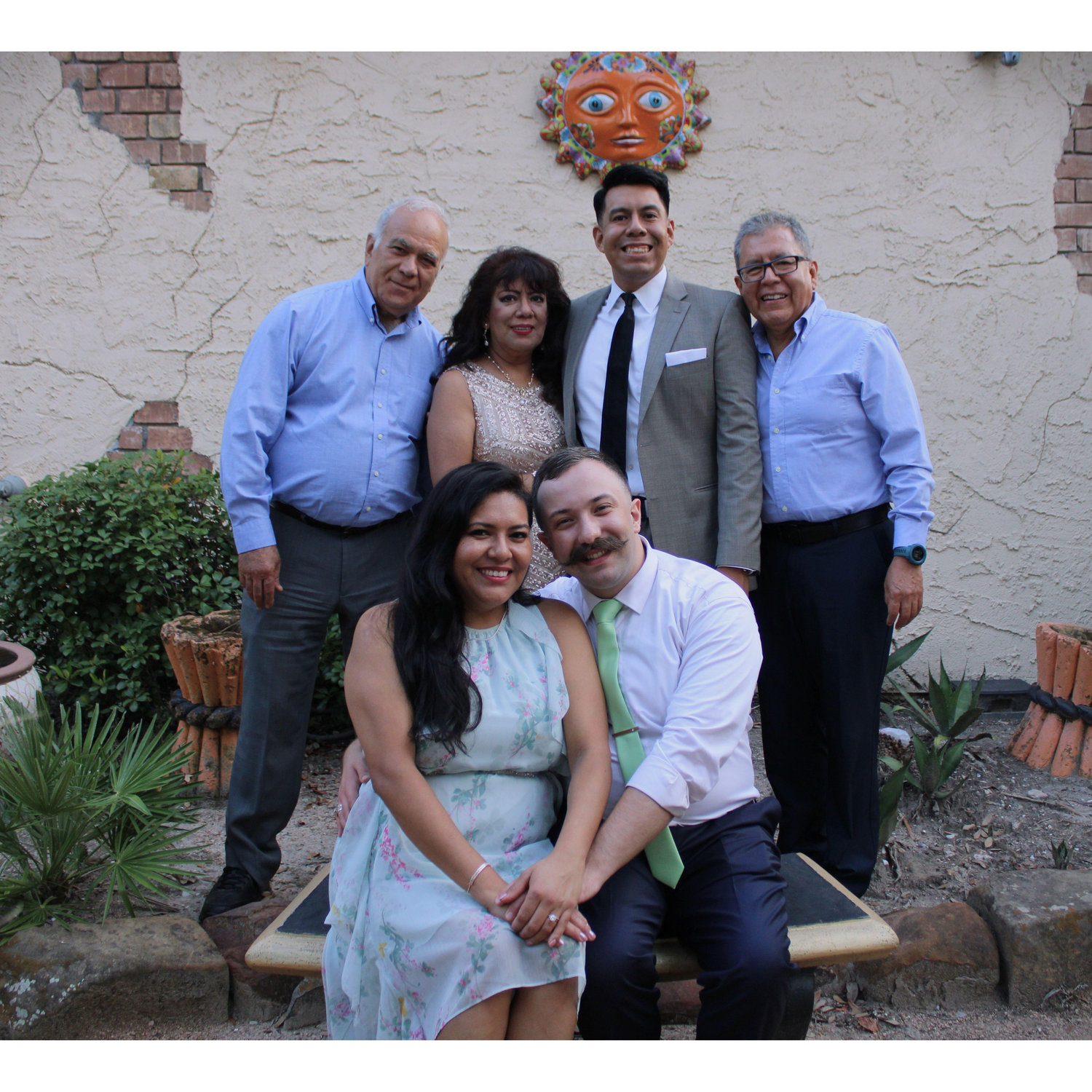 Laura and Joseph with their loved ones, celebrating their special day