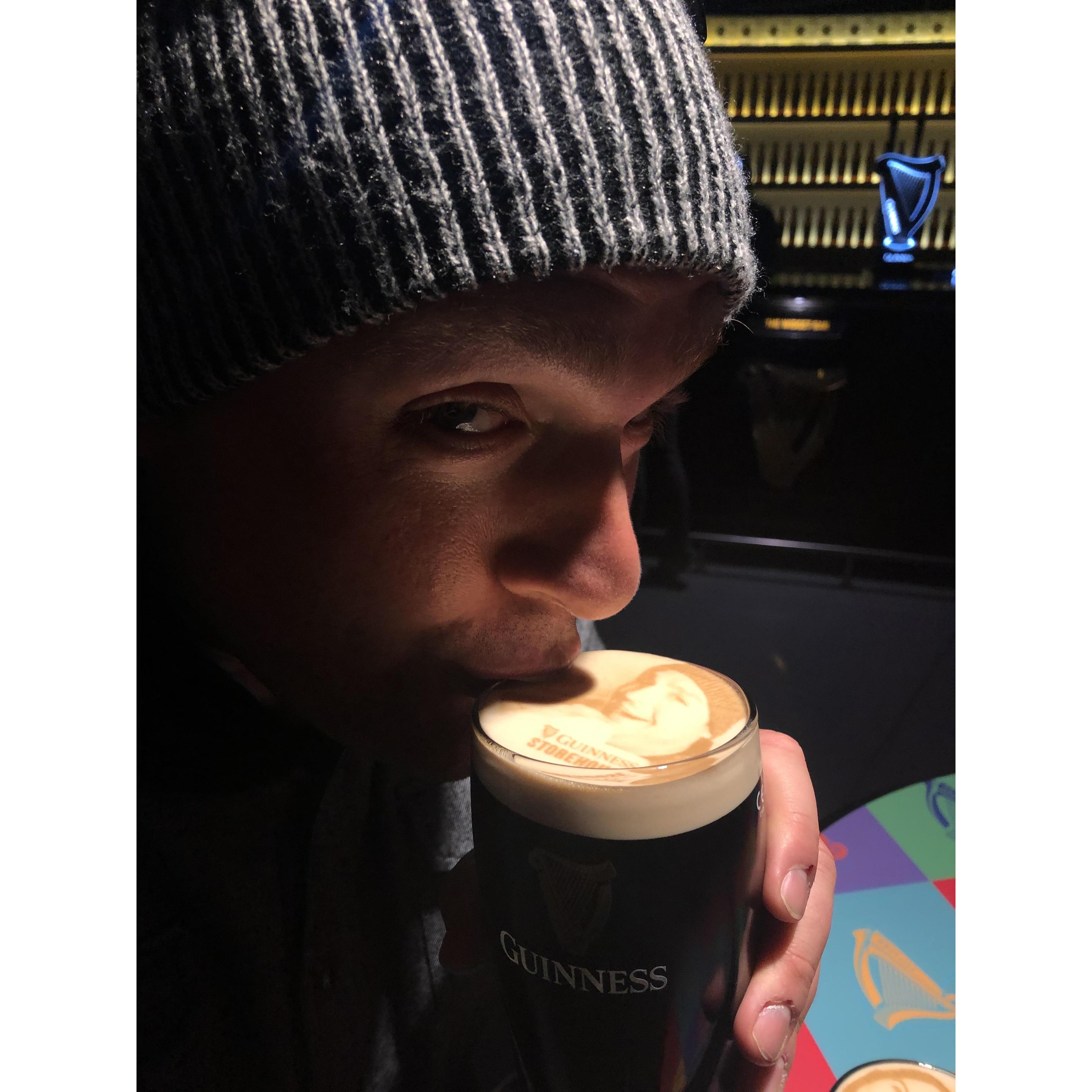 A picture of him drinking a Guinness after a picture of him holding a Guinness was printed on the foam o f the Guinness at the Guinness Brewery.