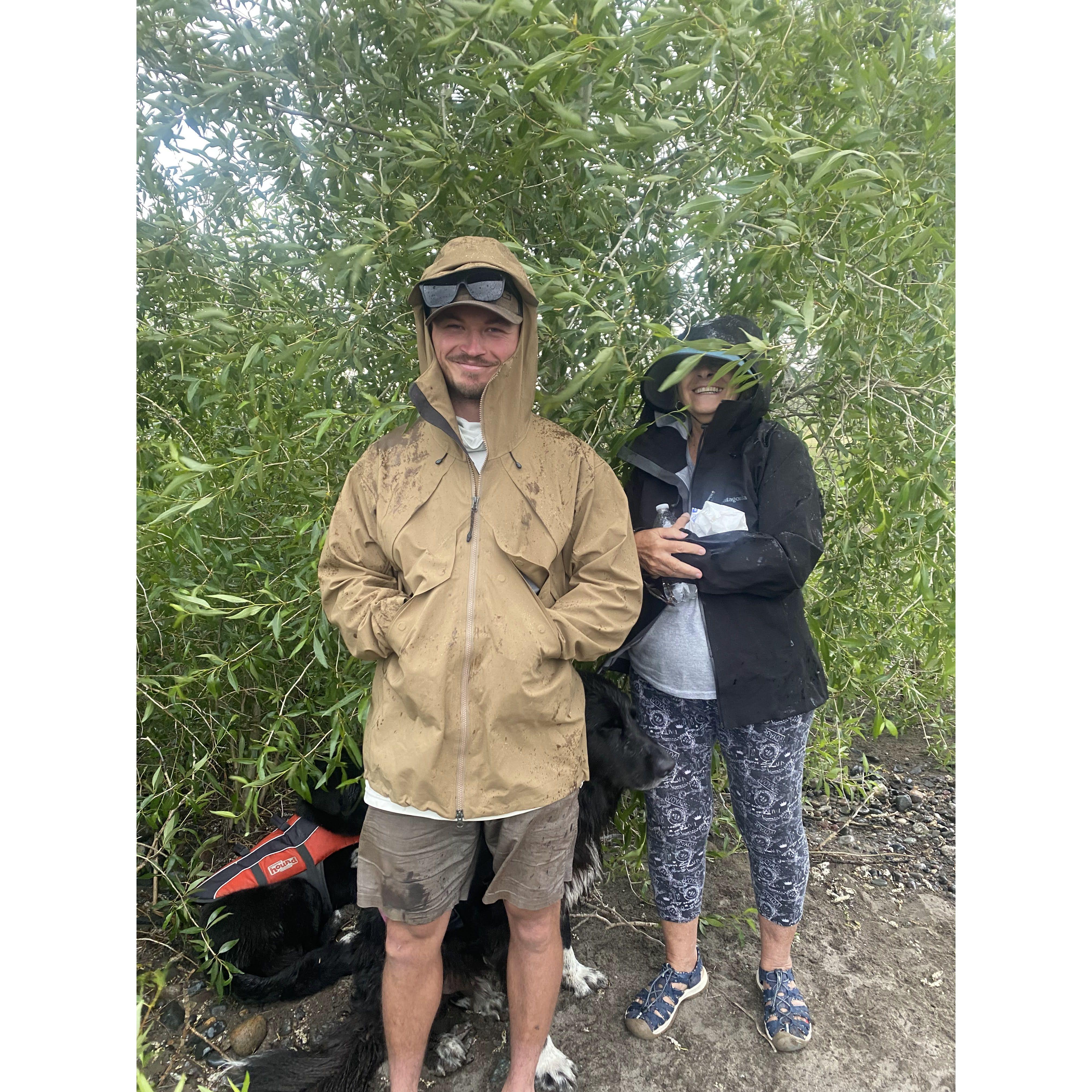 Grandma Valerie and Spencer waiting out the rain while out on the river