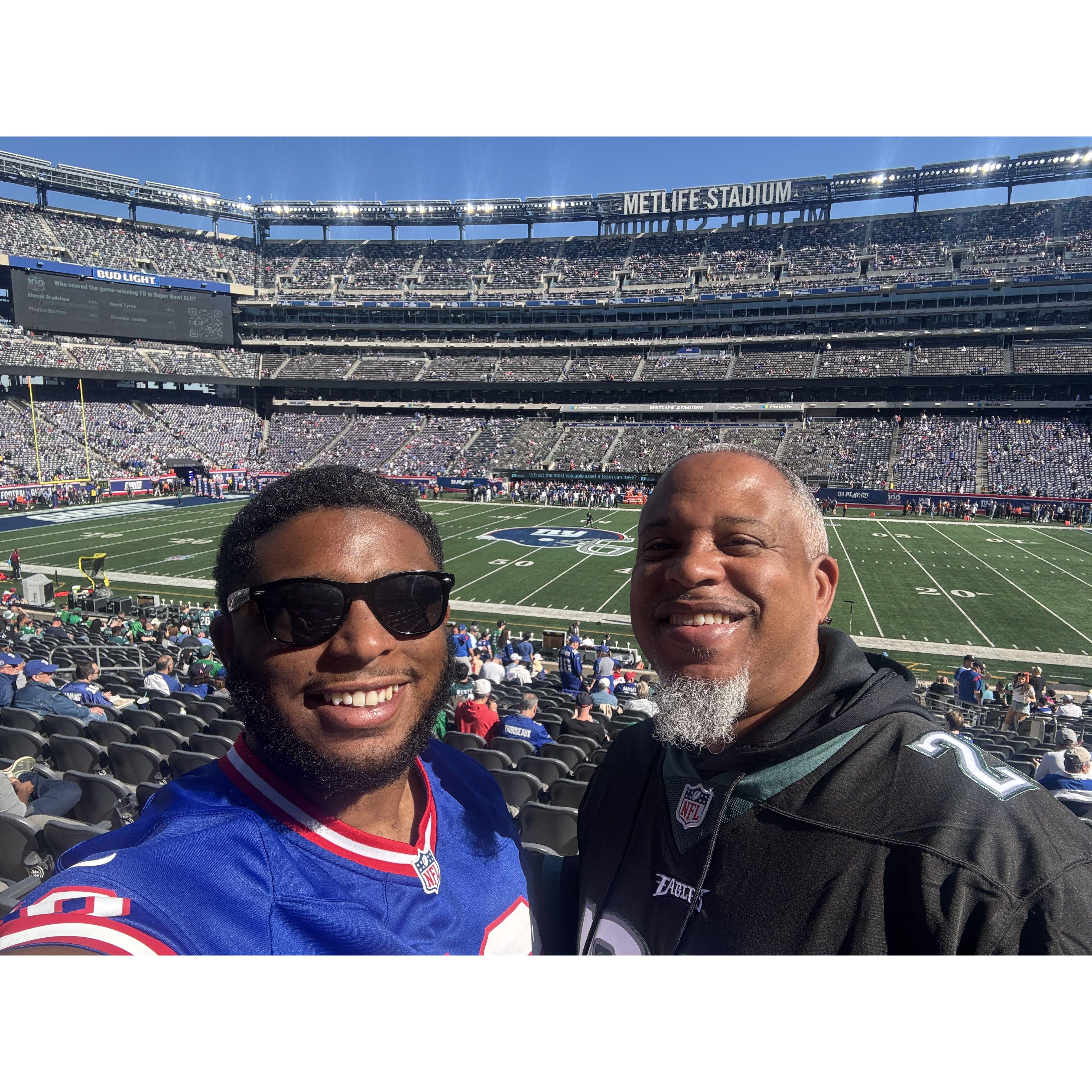 Robert and his dad, Robert Sr, enjoying a Giants and Eagles game!
