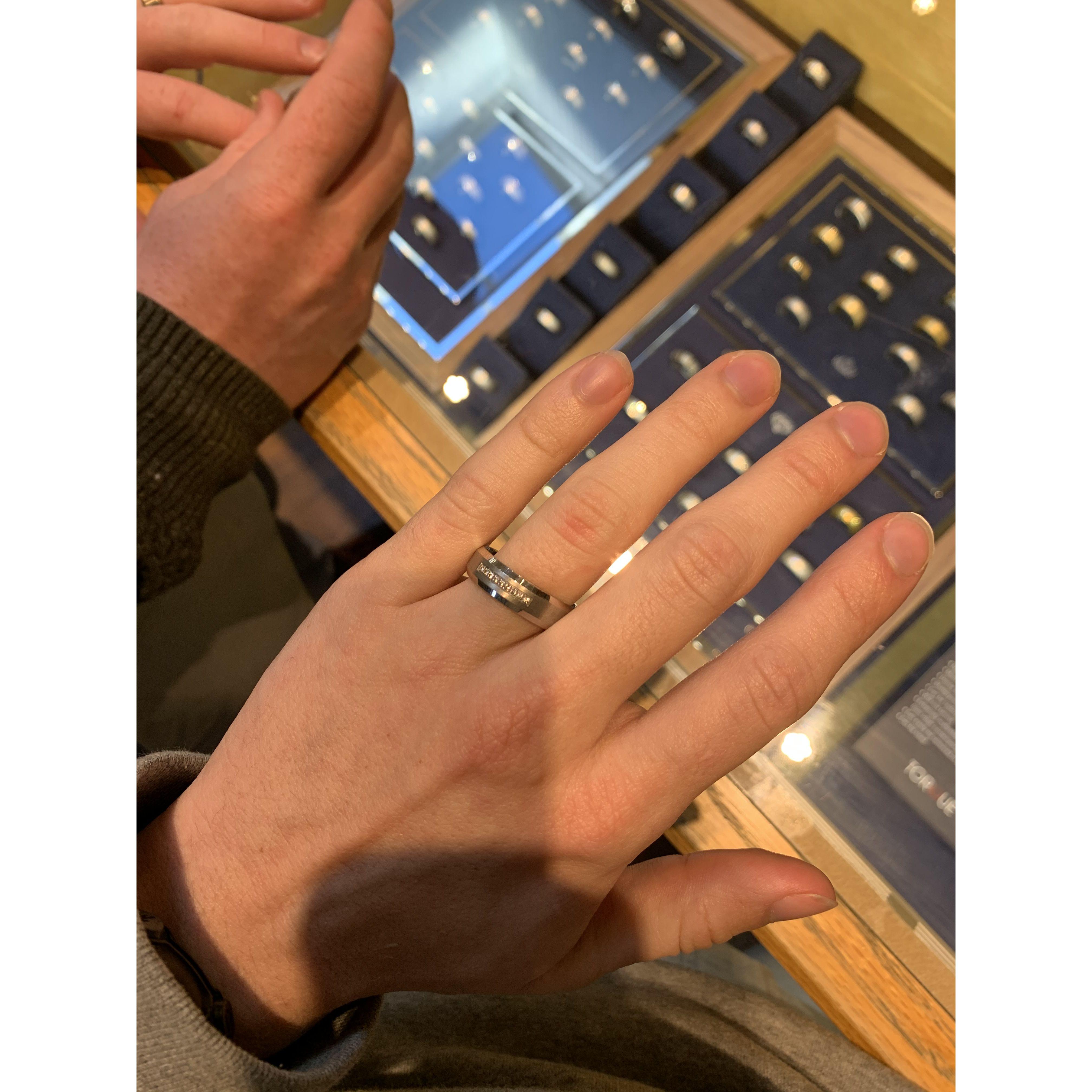 Logan trying on his ring for the first time