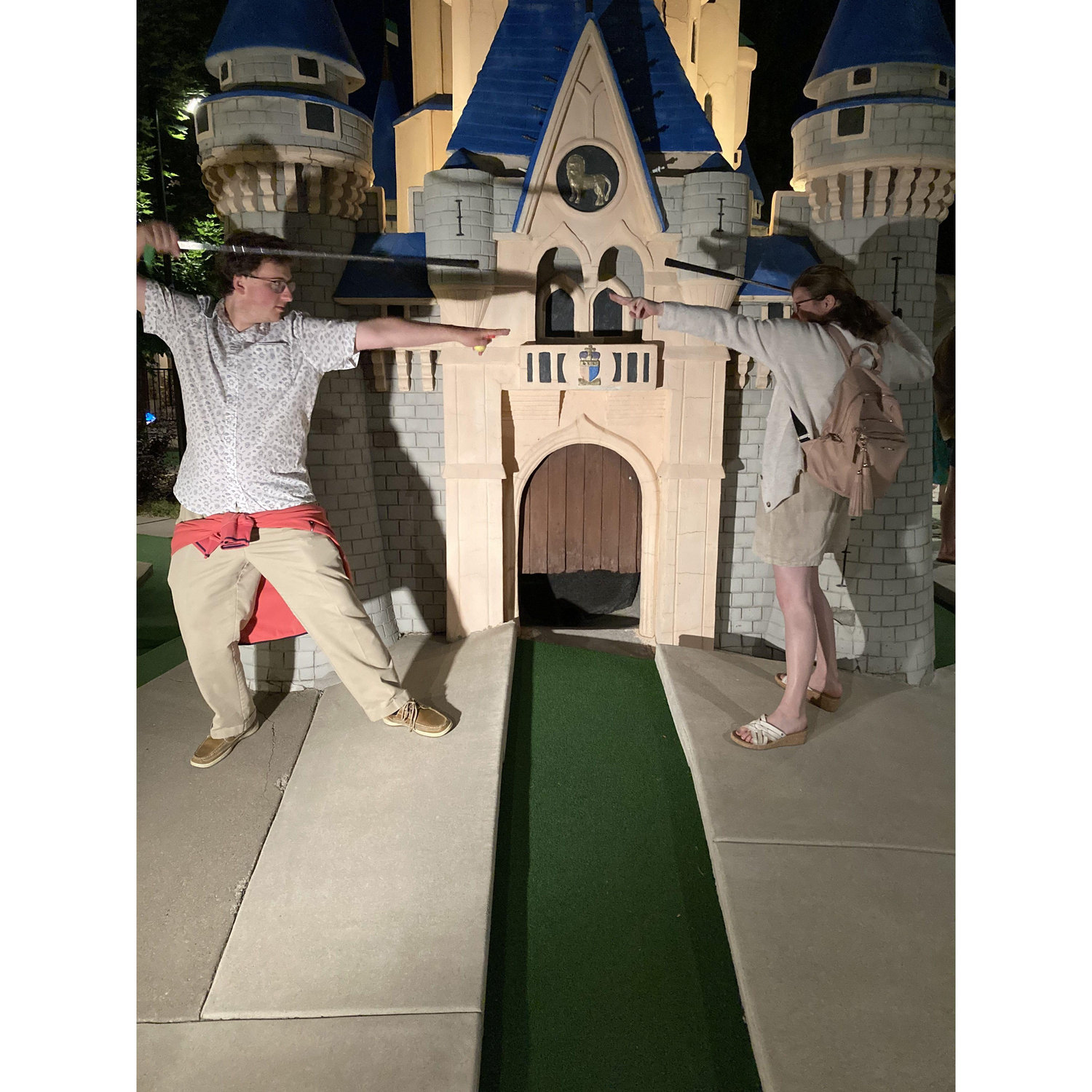 Practicing our lightsaber skills with the putters.