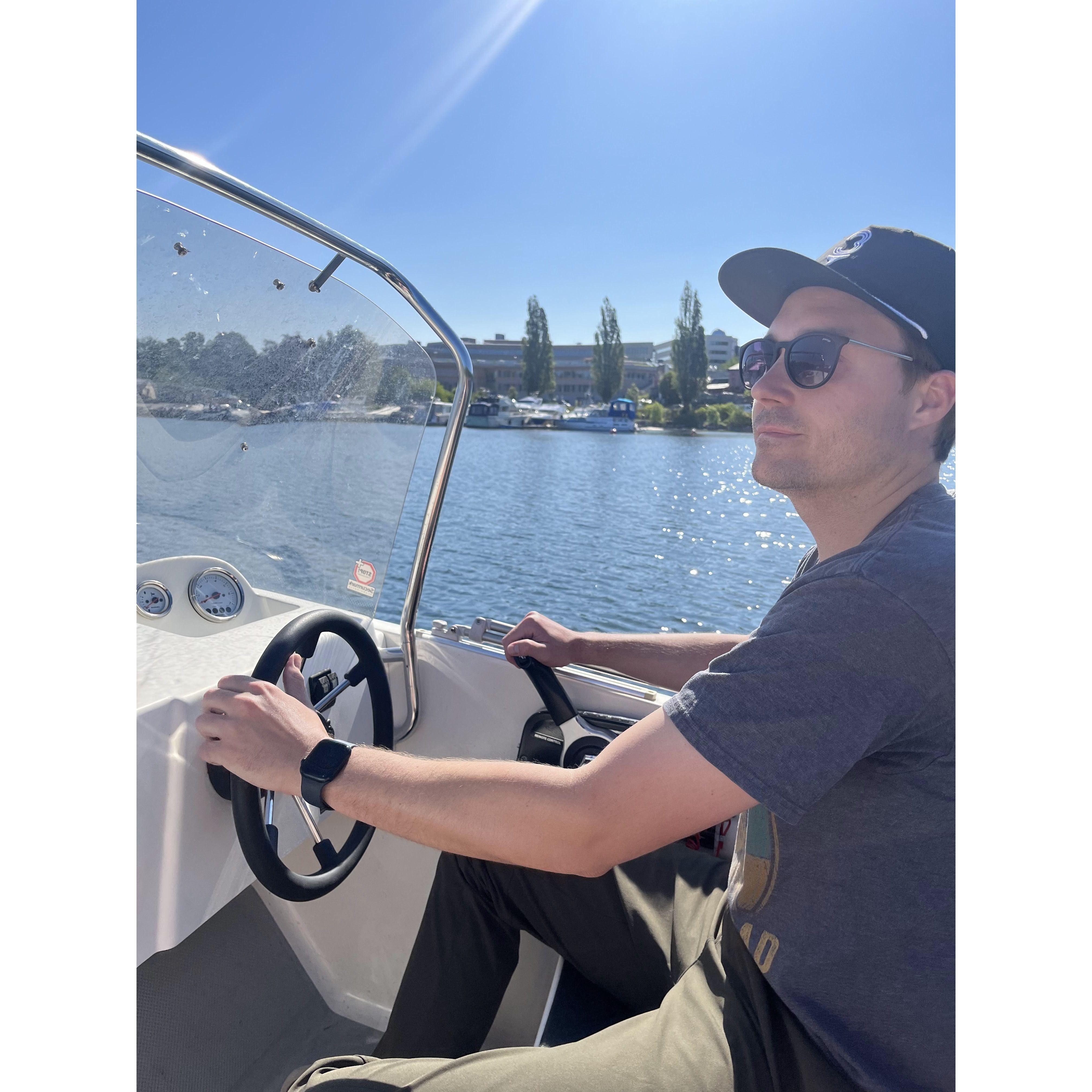 Travis driving the boat he rented to propose in Stockholm, Sweden! (Jenny had no idea and was trying to take a nap when Travis was trying to propose. classic.)