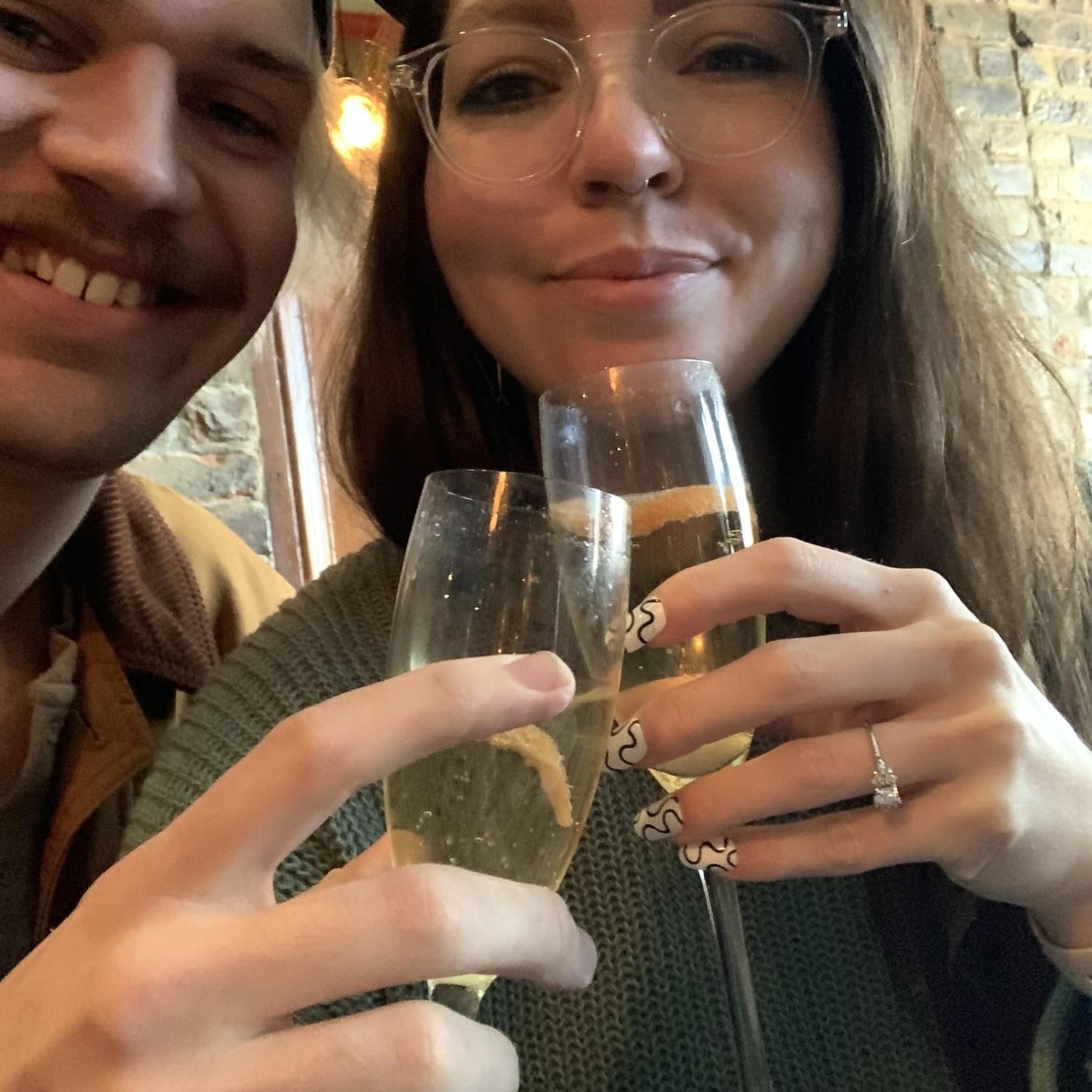 The first glass of bubbly after the proposal