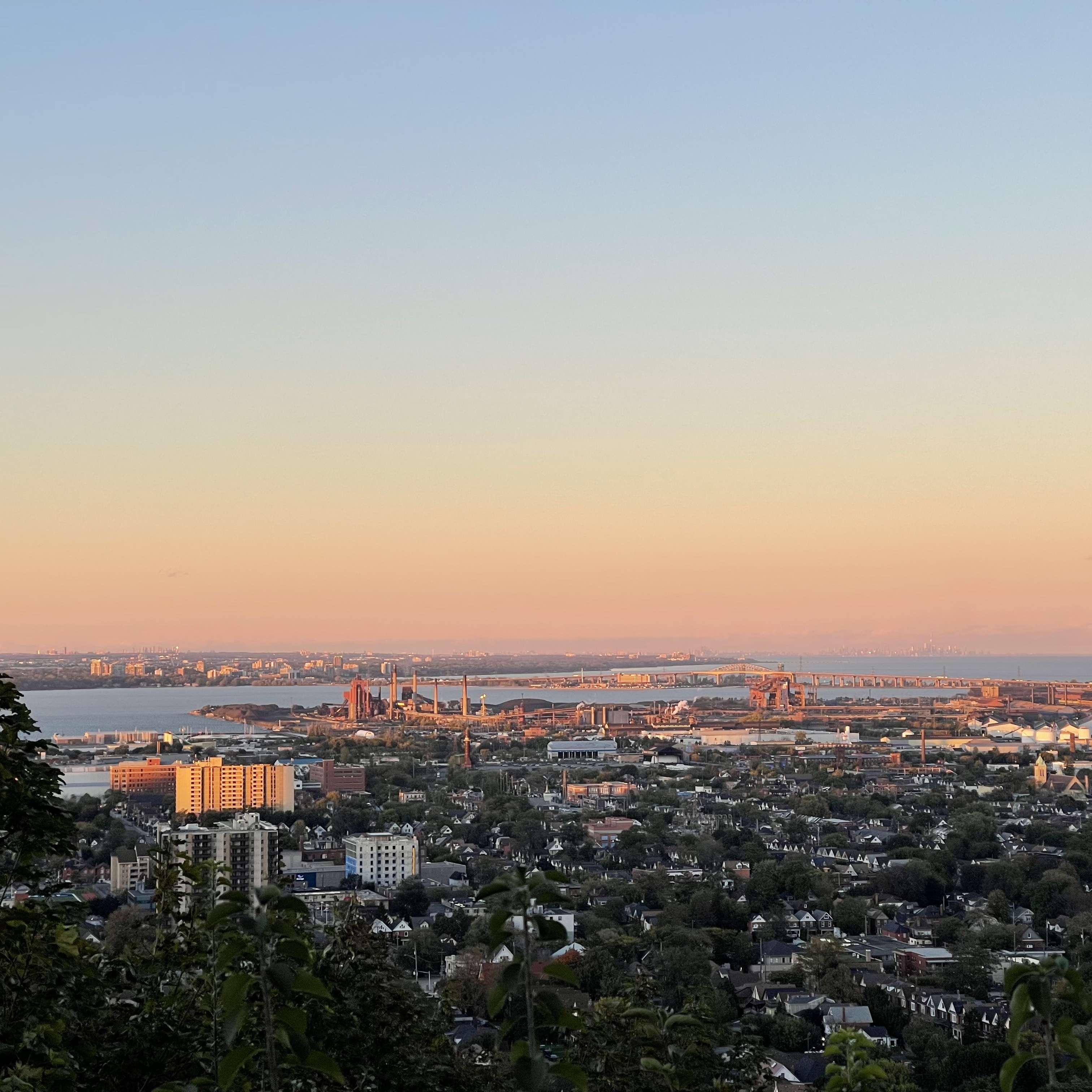 View of Hamilton and Hamilton Harbour/Burlington Bay from the top of the Wentworth Stairs. Aldershot and Burlington are across the water and if you squint you can see Toronto on the horizon.