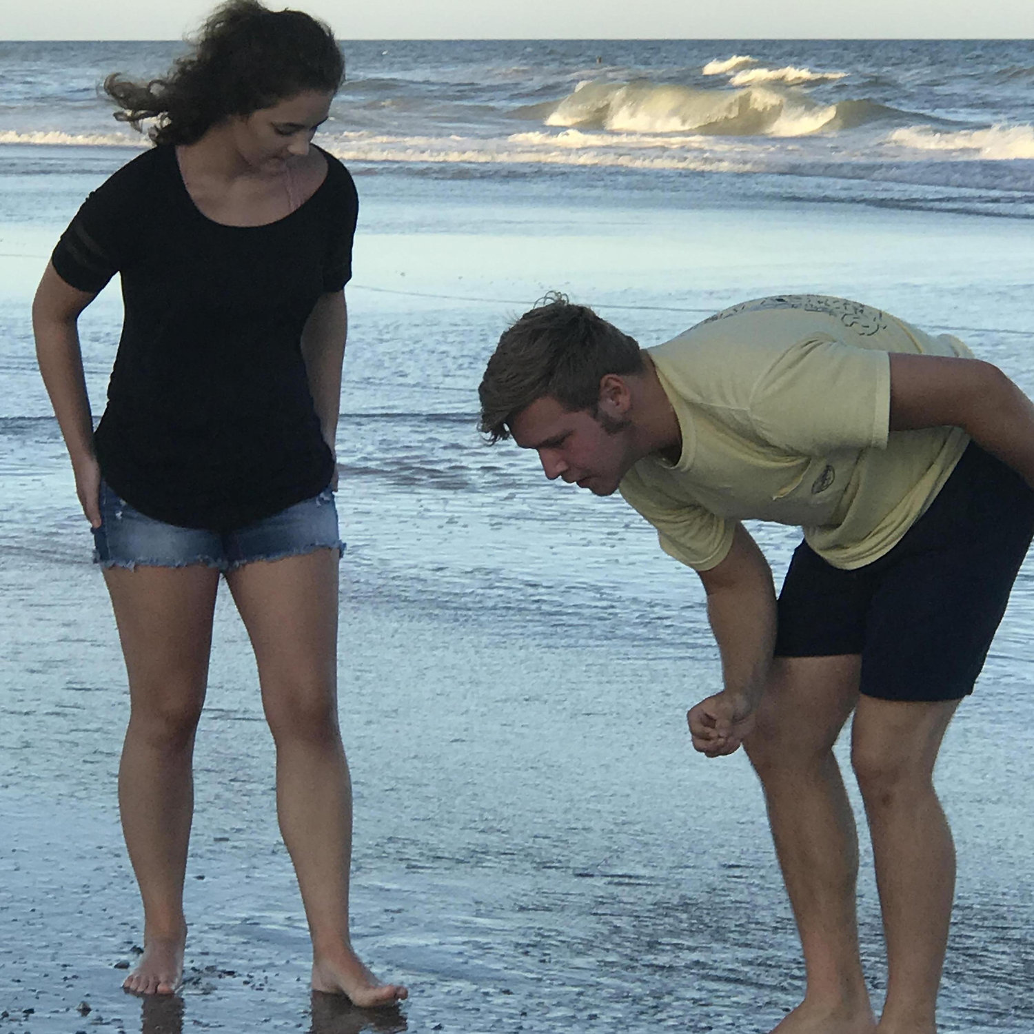 Candid of our favorite beach activity; Maegan finding more shark teeth than me