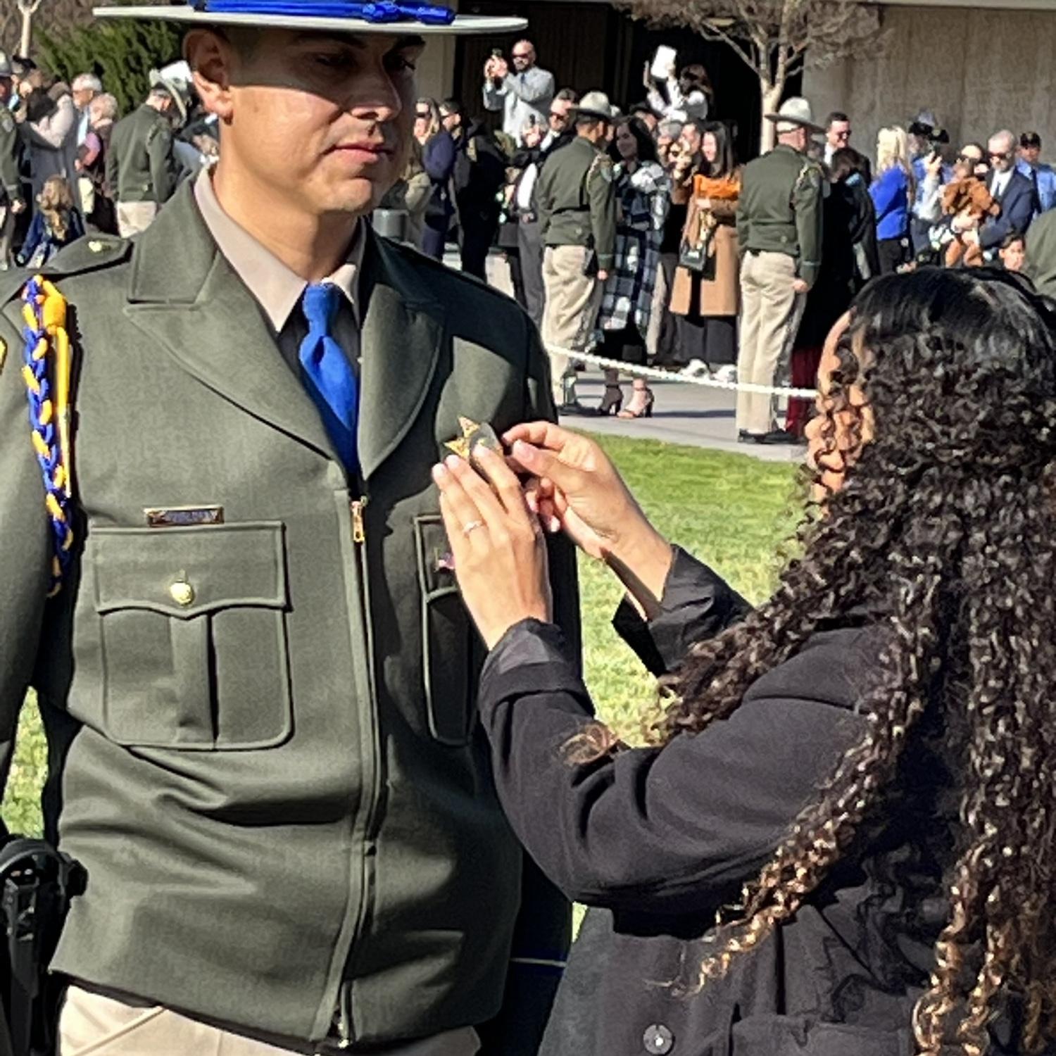 A proud moment. I got to pin Luisâ badge on graduation day. We were both holding back tears. A weight was lifted. I remember repeatedly thinking, âyou did it,â hoping he could hear my thoughts.