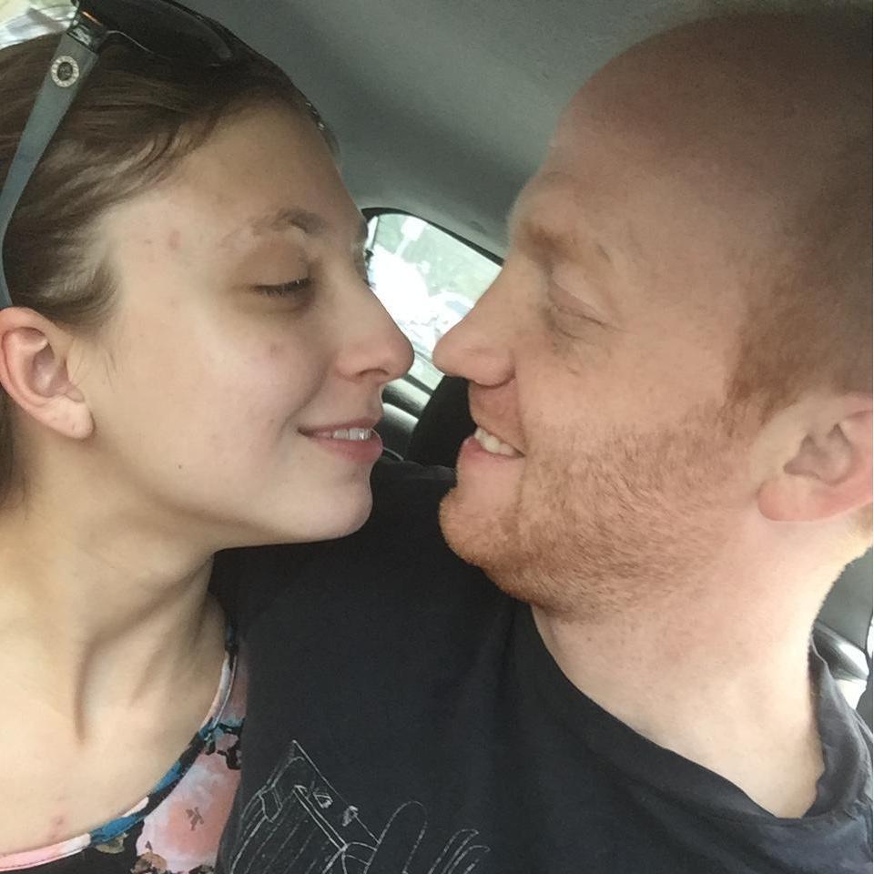 In my car, right before shopping.  I found this shirt for him in maroon on eBay so he could have one without holes!