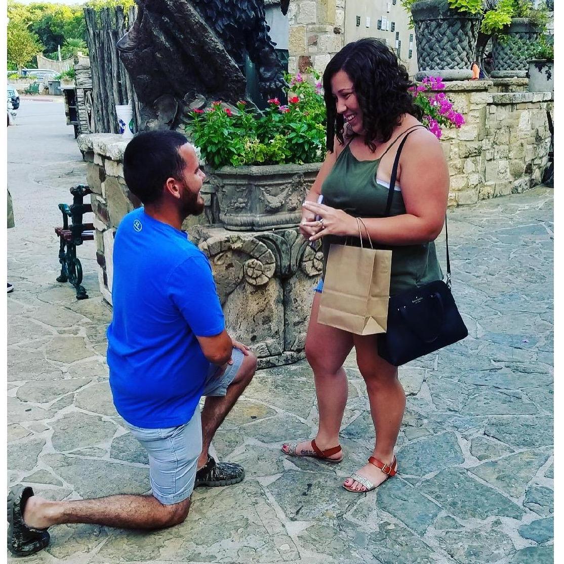 Johnathan getting on one knee to propose to Brianna in front of his family. July 31st 2018