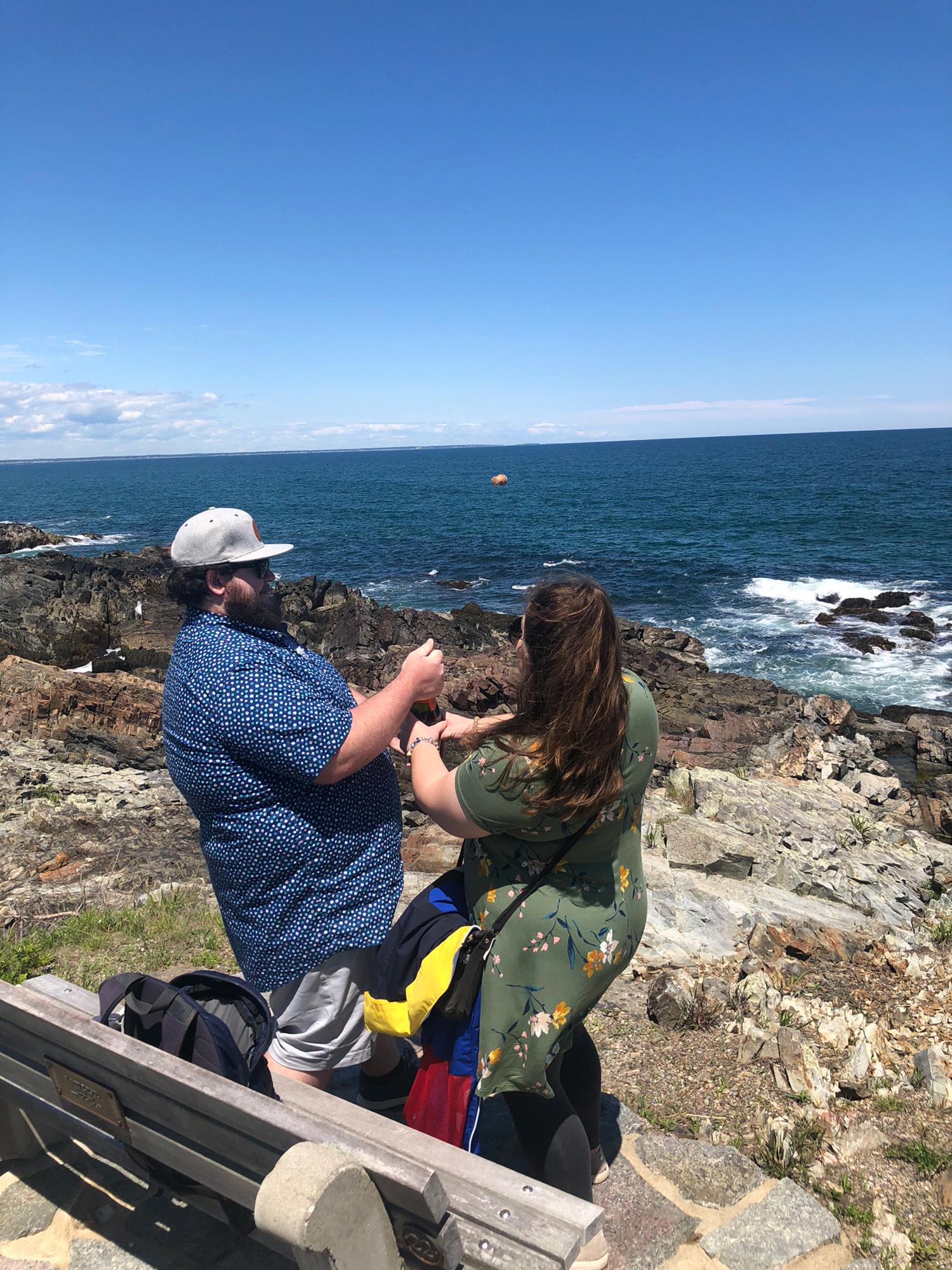 Popping champagne after getting engaged! (You can see the cork in the air over the ocean!)
