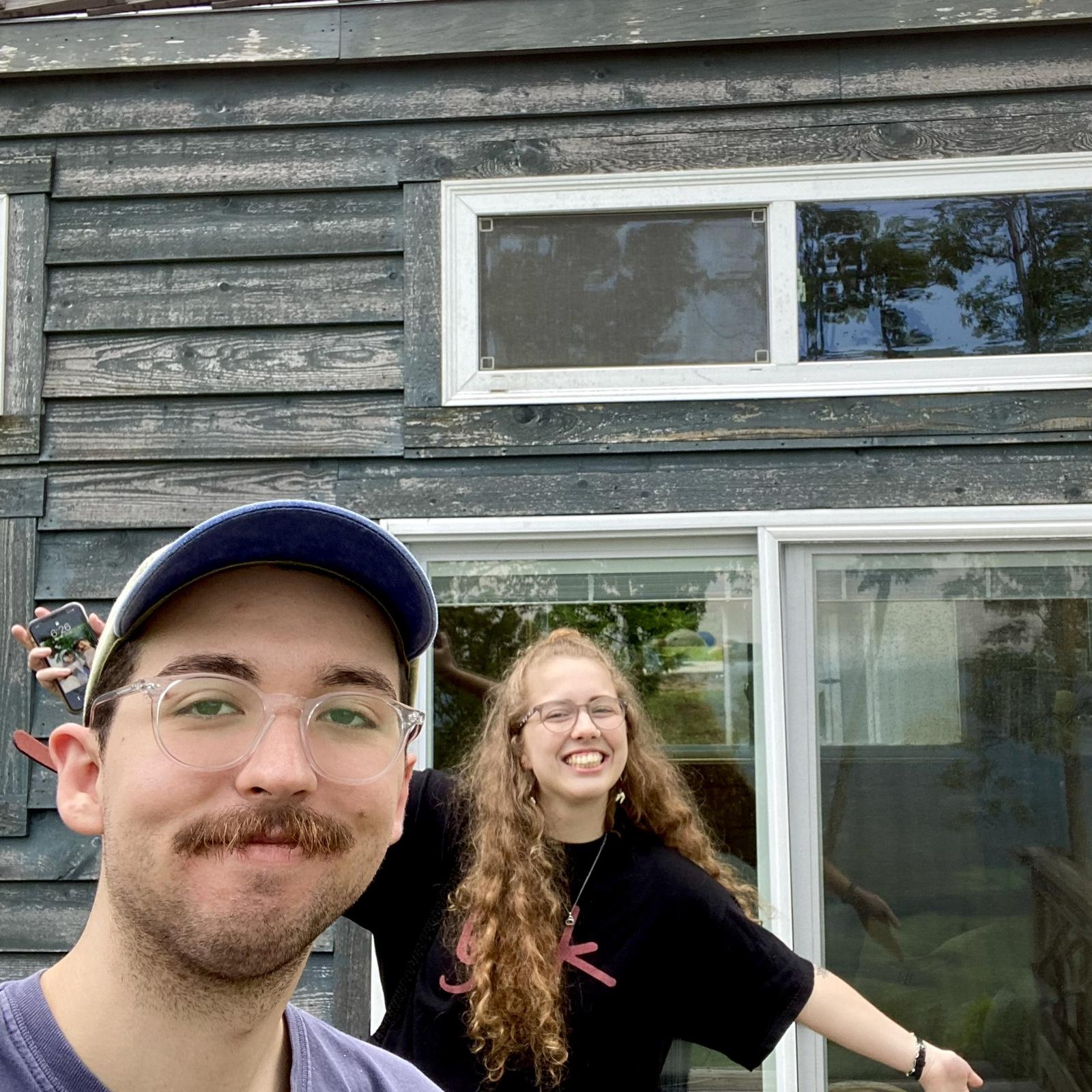 Us at the tiny house we stayed in for our 1 year anniversary