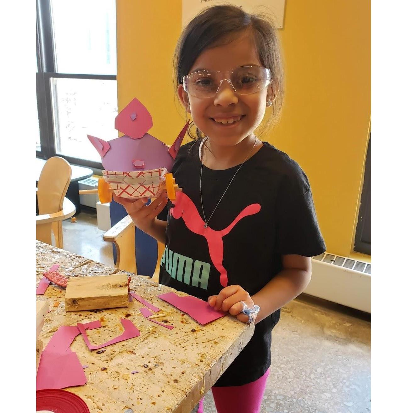 Ellie creating new cars at the Children's Museume