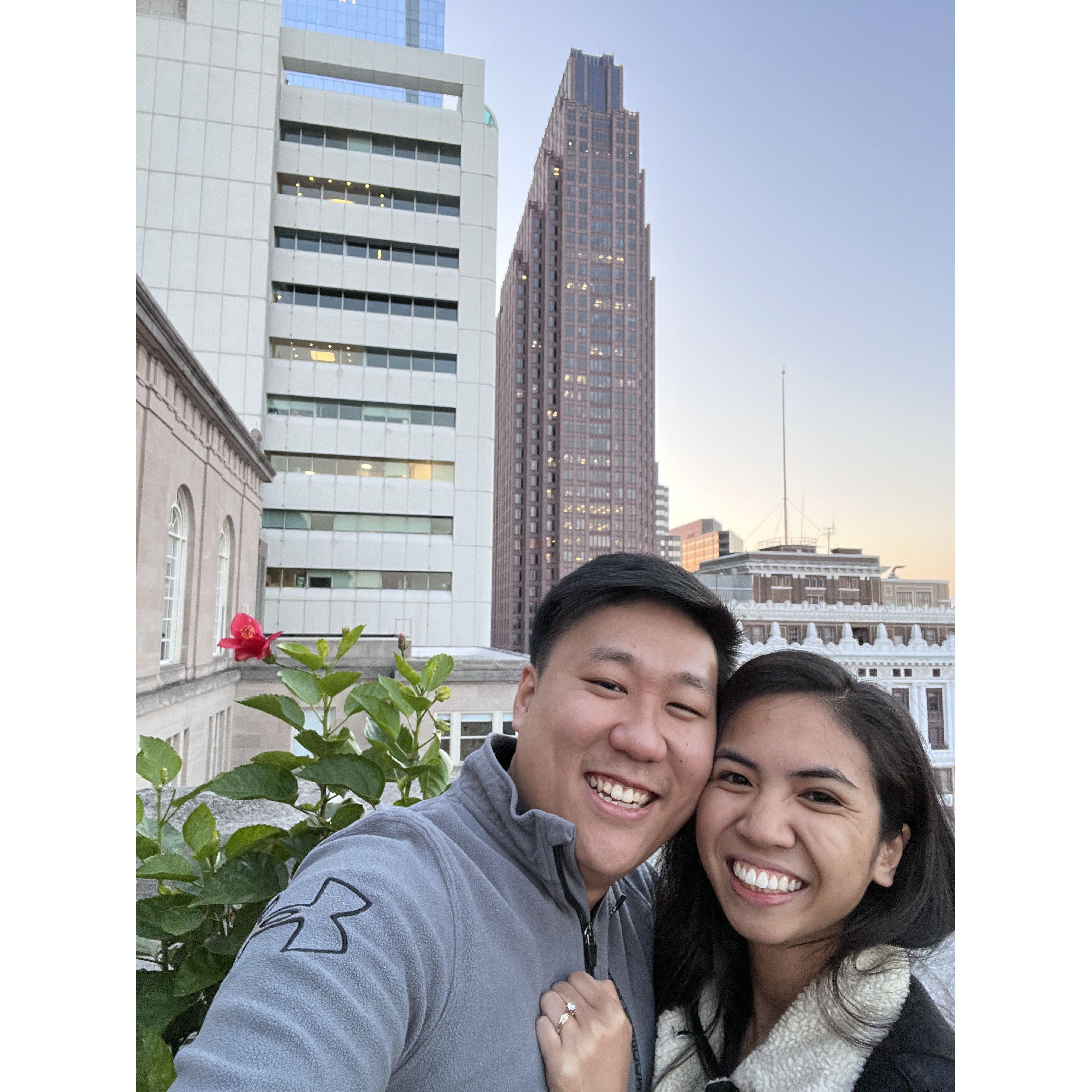 Newly engaged! Didn't know our future venue would be in the background!