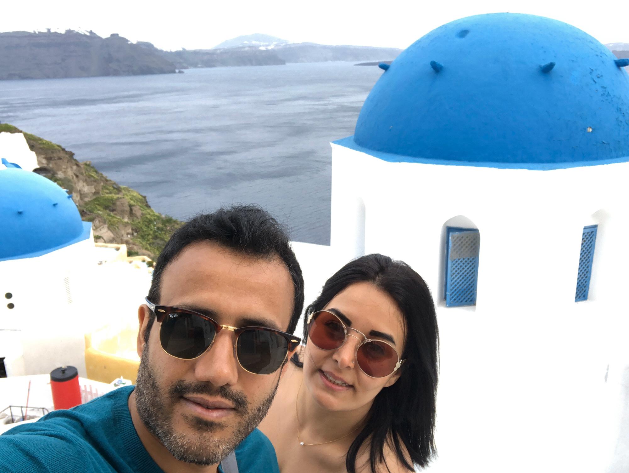 The famous blue-domed churches in Santorini. Greece.