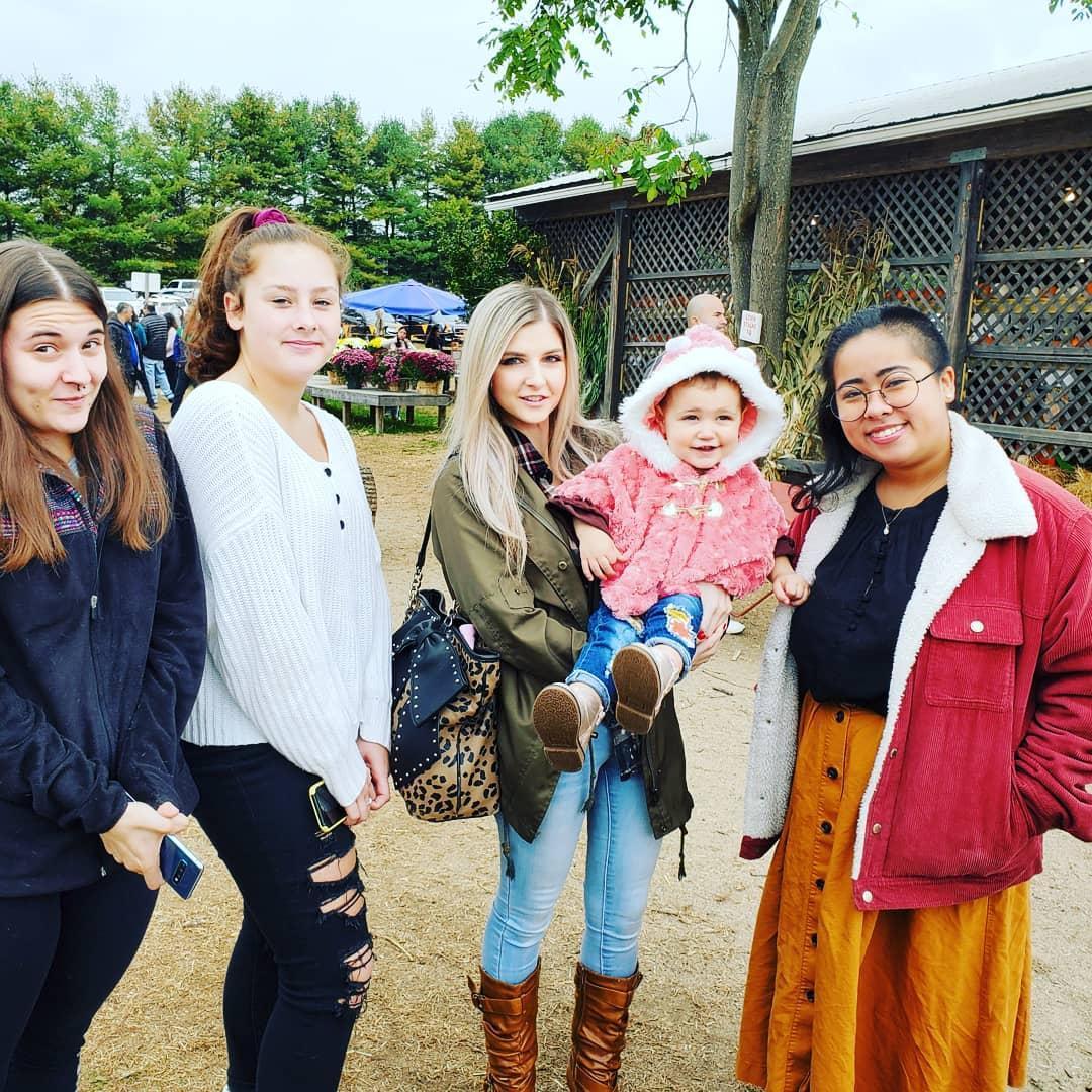 Pumpkin picking...Ariella rarely makes straight faces