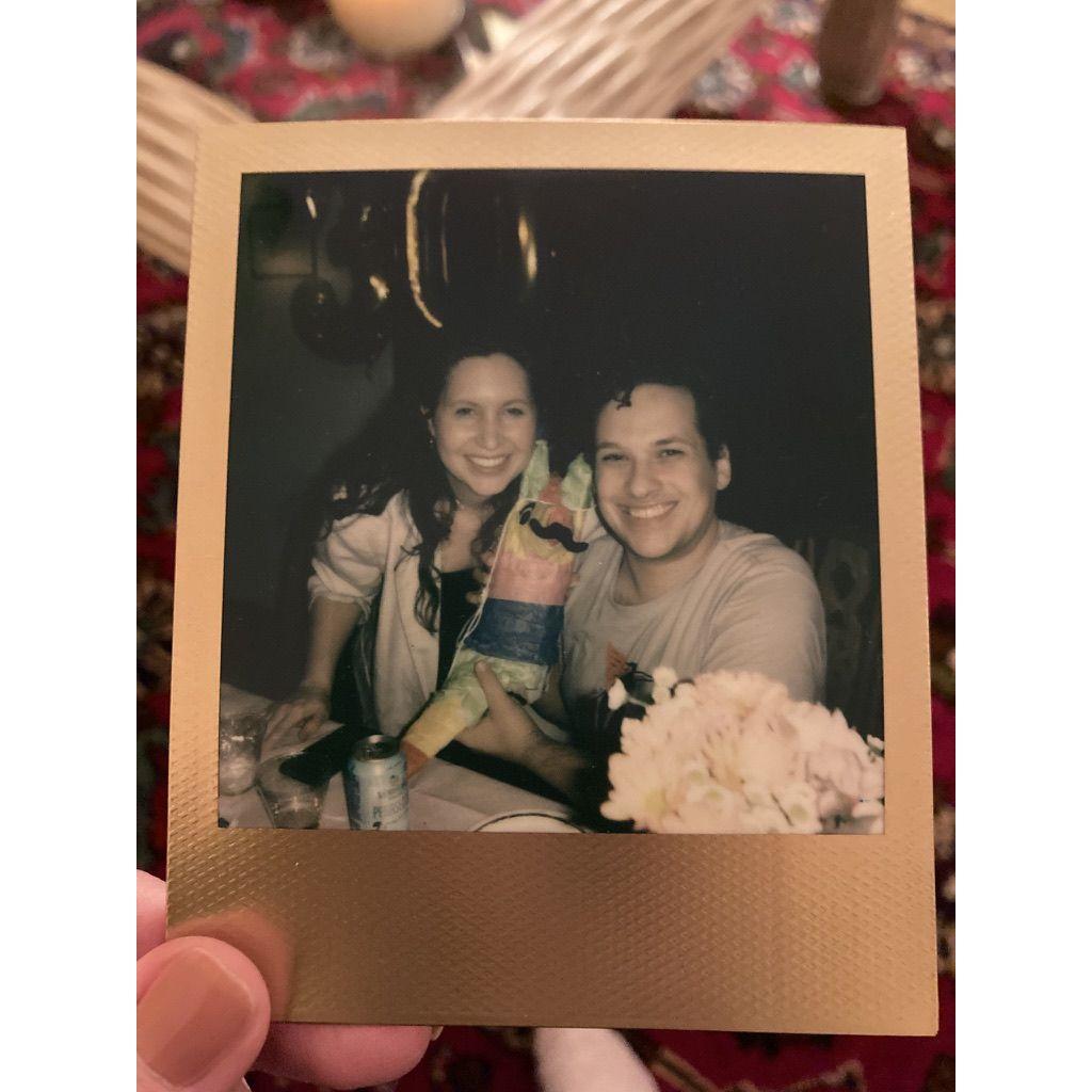 Andrew gave Libby a Polaroid camera for her 30th birthday