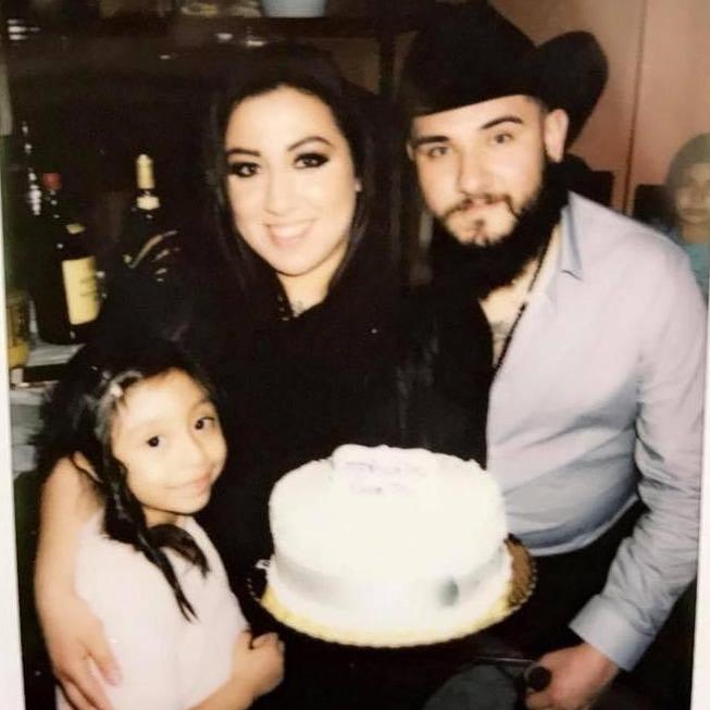 NYE engagement  picture taken after the proposal with our first cake given to us by cousin Ivan and Rosario