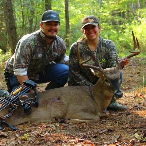 One of our many firsts together. Melissa's first buck with a bow.