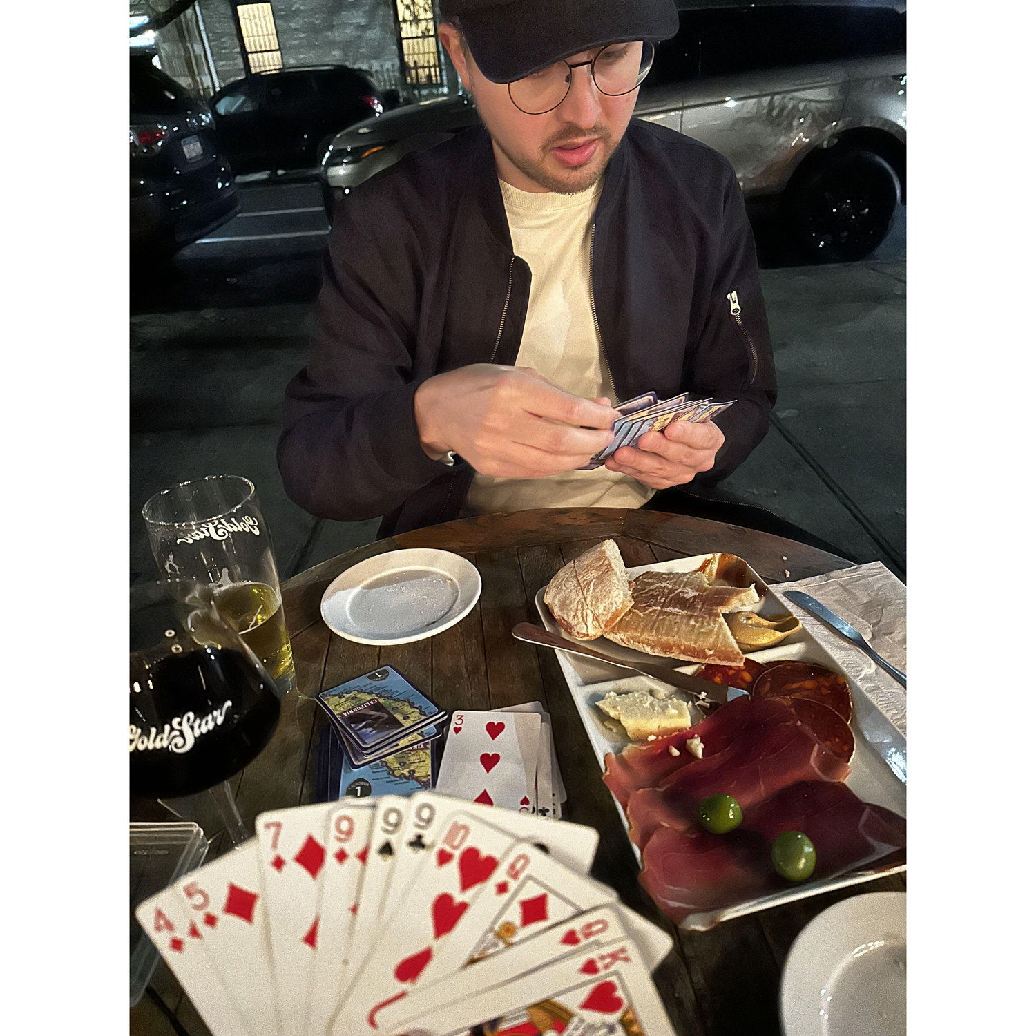 So many nights spent at our neighborhood beer counter with a charcuterie board playing cards. Ask us who is winning our all-time tally of Gin Rummy :)