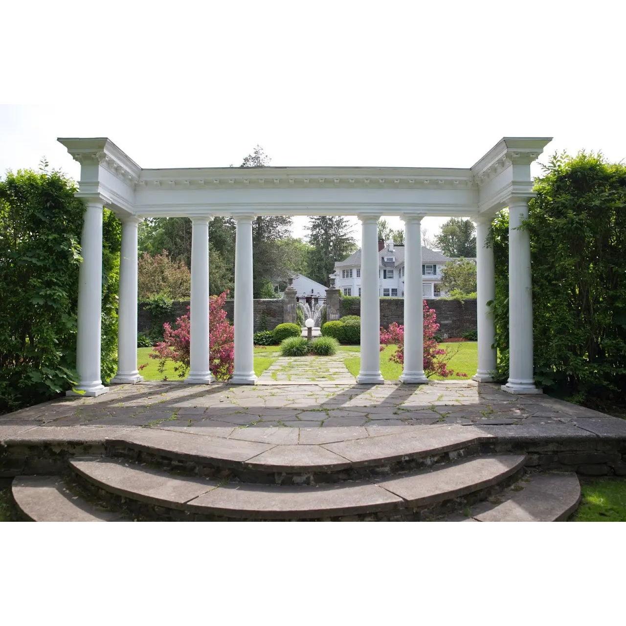 The pergola at the Harding Allen Estate stands as a picturesque sanctuary, gracefully combining elegance and natural beauty, creating an idyllic backdrop that captures the essence of romance and tranquility.