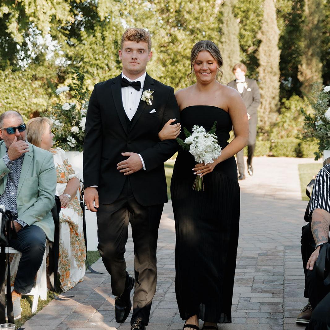 Walking down the aisle together at Nora & Caden's wedding!