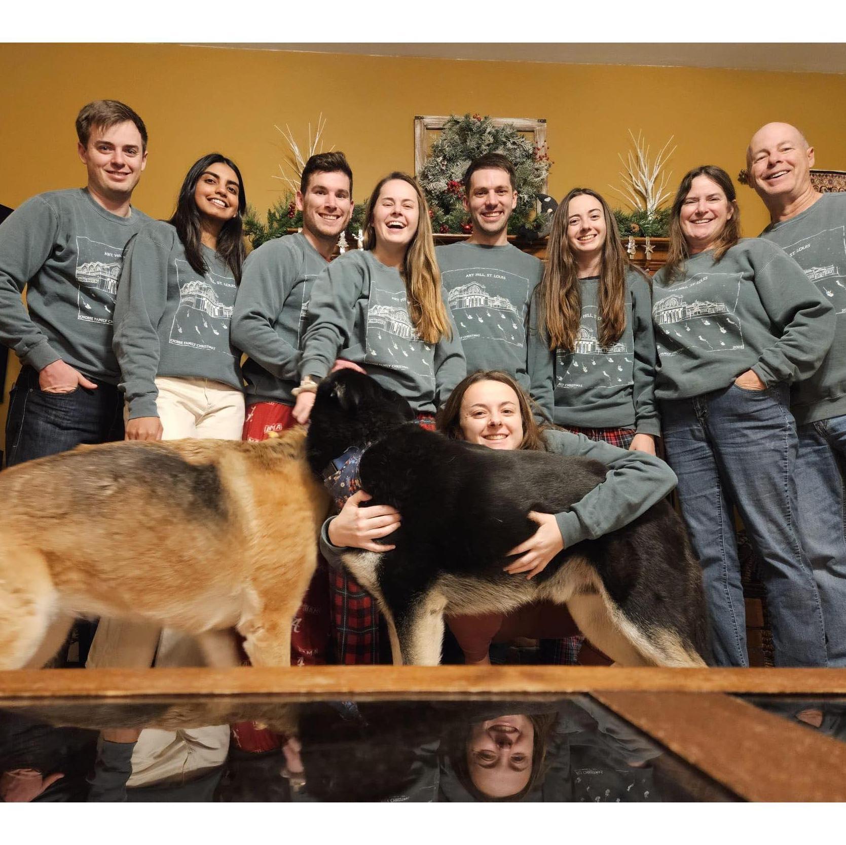 Celebrating some during the Christmas holiday with Kelsey's immediate family!
Left to right: Tyler, Pravi, Alec, Kelsey, Ryan, Jessie, Audrey and Jay. Kari in the front hugging our third pup, Ryden!