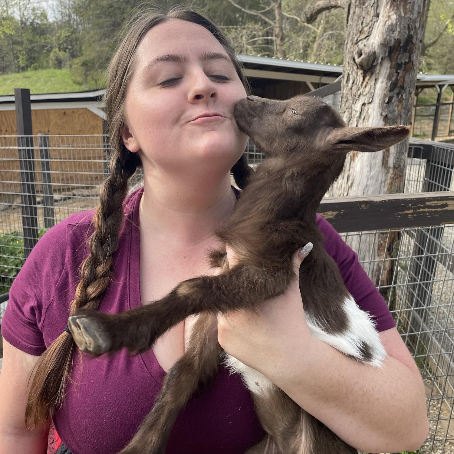 Savannah and her second true love - a baby goat!
