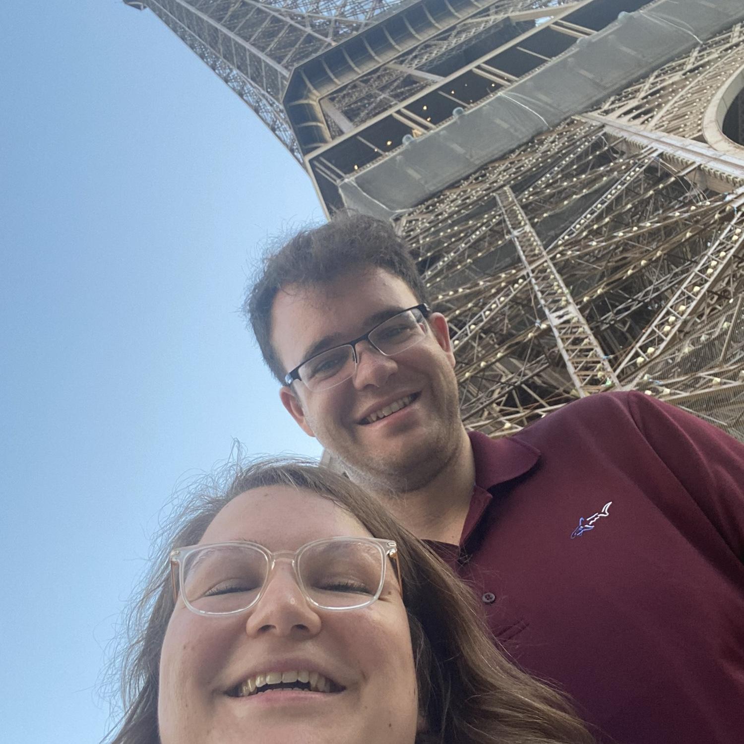 We went on a trip to Paris together in August 2022. There is a famous Parisian building behind us in this photo.