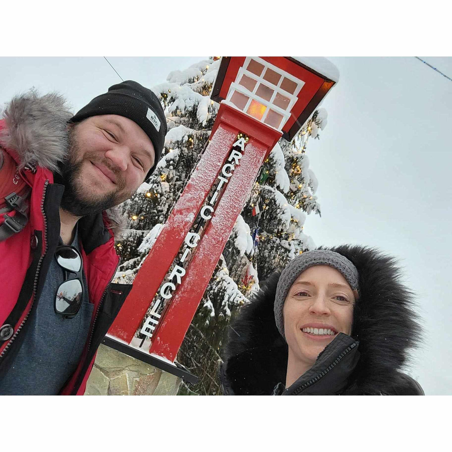Us at the Arctic Circle - it wasn't as chilly in December as you'd think!