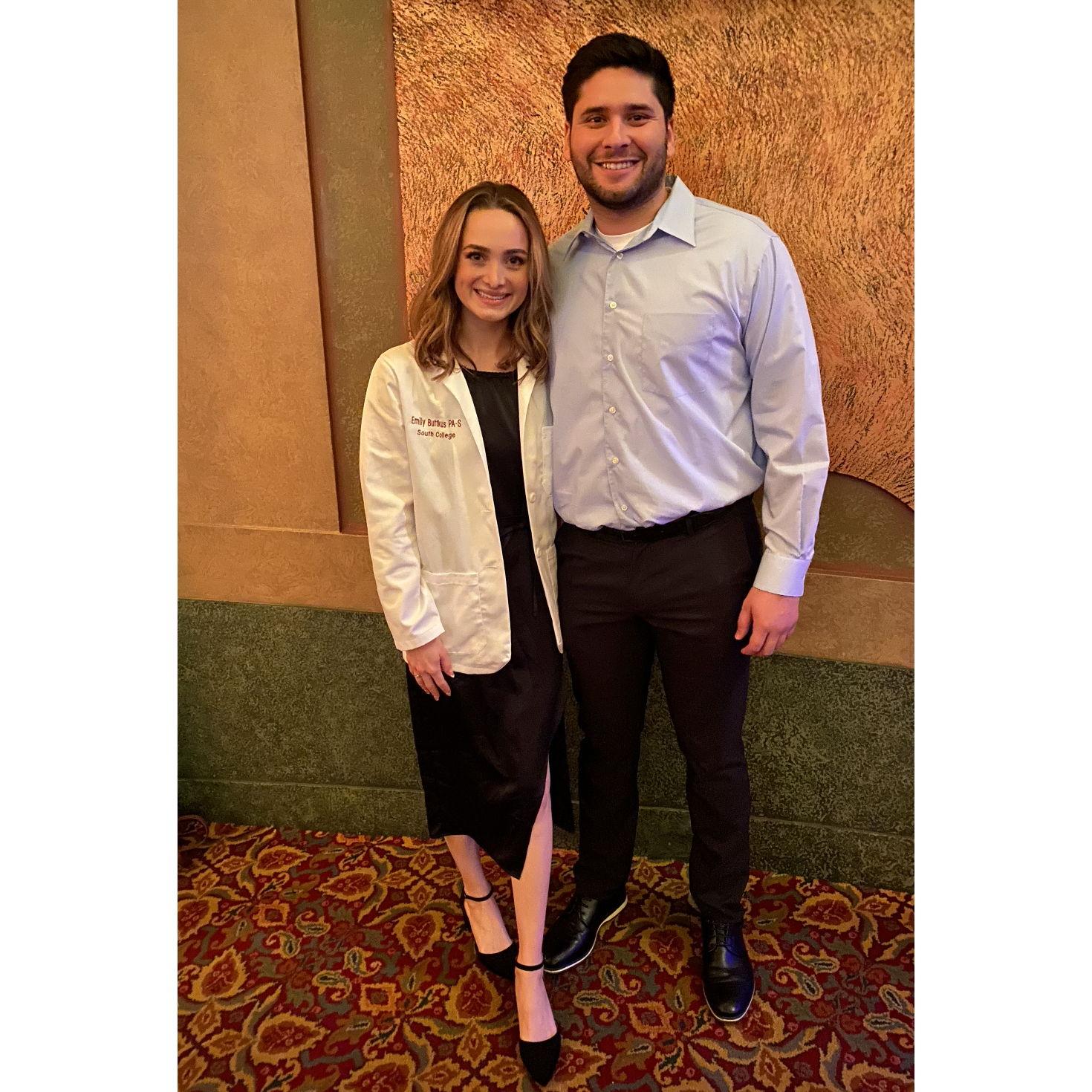 At Emily's whitecoat ceremony for PA school in December of 2021. Who knew we would be getting engaged in just a few days... (everyone but Emily)