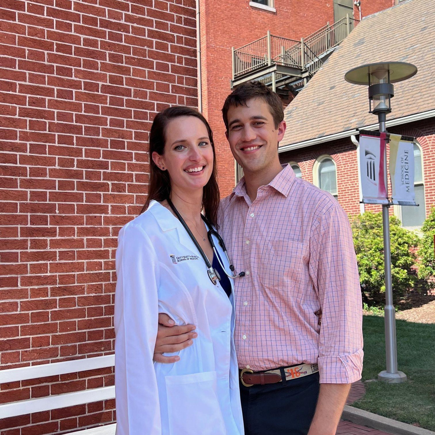 Michael supporting Lilli at her white coat ceremony in 2022. Look how proud he looks!