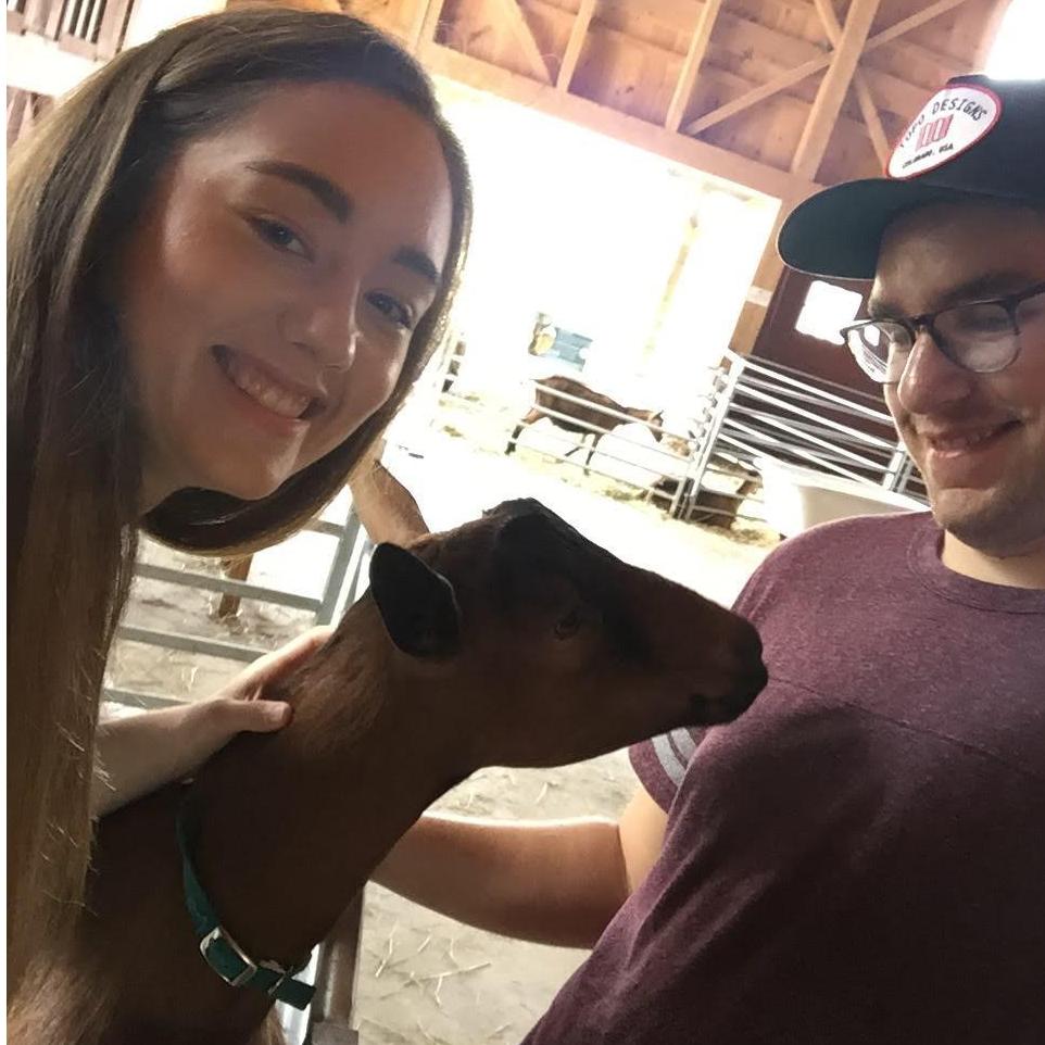 Beautifully posed photos aside, Sam insisted we include this one. Johanna loves barn animals, and Sam loves Johanna. And the goat loved Sam's shirt. A narrow escape.