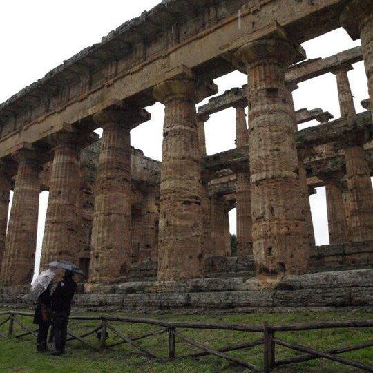 Just us in the rain looking at some Greek ruins in Southern Italy