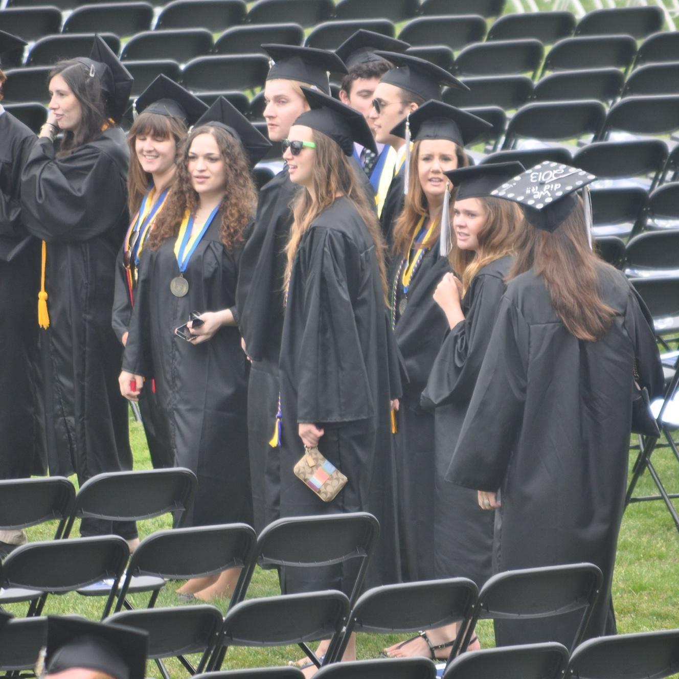 Feet from each other at Ithaca College Commencement, 2013