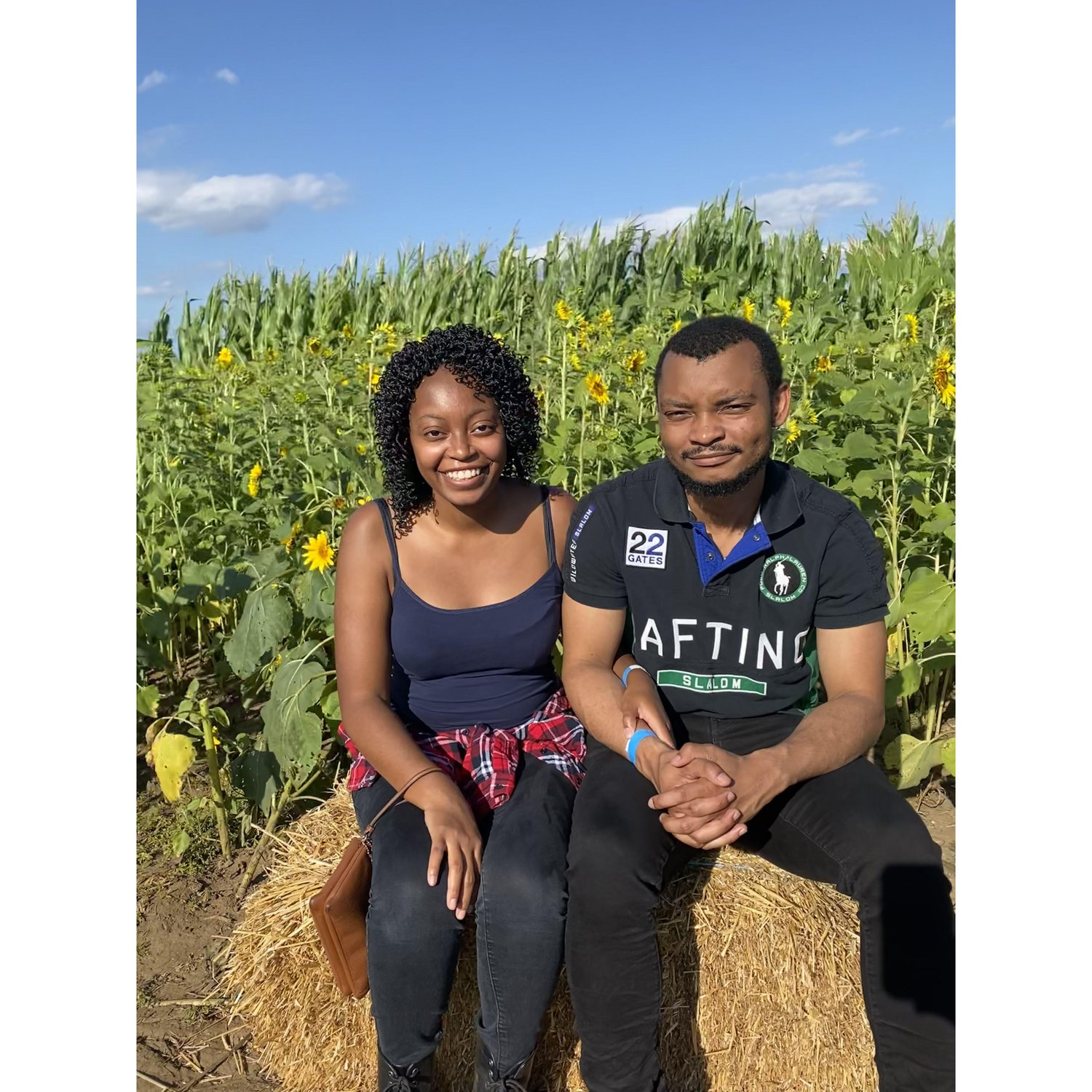 Photo of the couple going pumpkin picking and to a hayride.