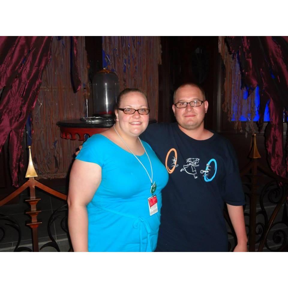 In front of the rose at Be Our Guest Restaurant in Disney.