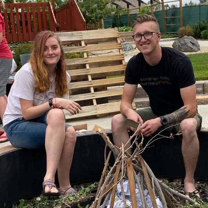 Building a fire at a family barbeque