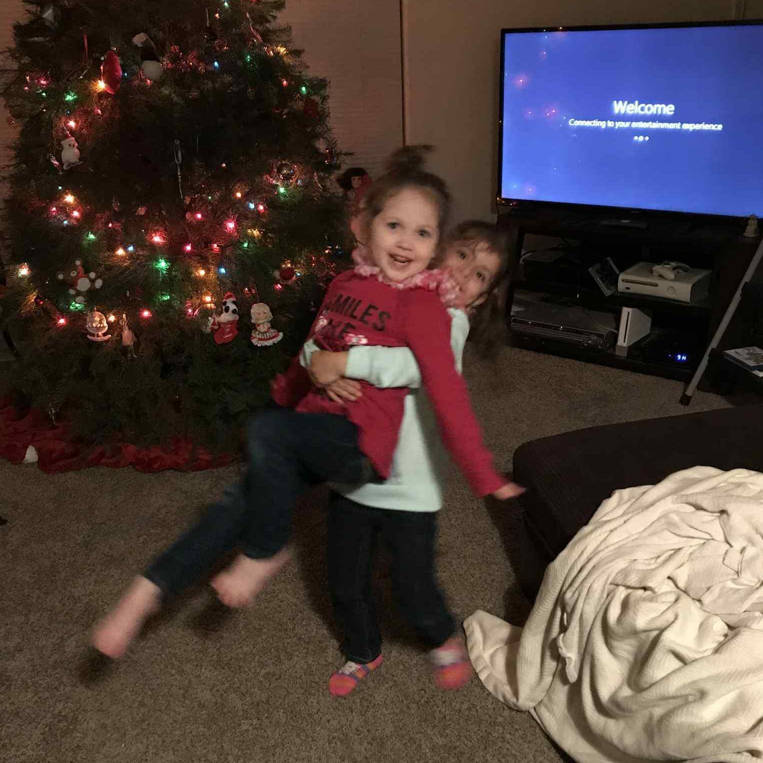 Leia was always picking up Scarlett lol. Our first Christmas we spent together, 2017