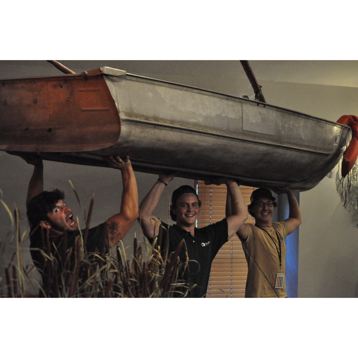 Donovan, Bear, and Larry carrying the boats and the logs 💪