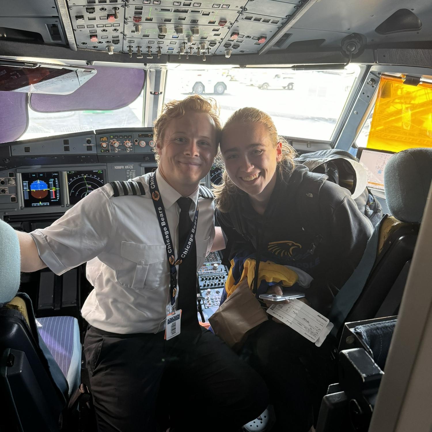 Kristen and Sean before the first commercial flight that Sean flew her on. Of course Kristen got to sneak a peek at Sean's office (for the day)!