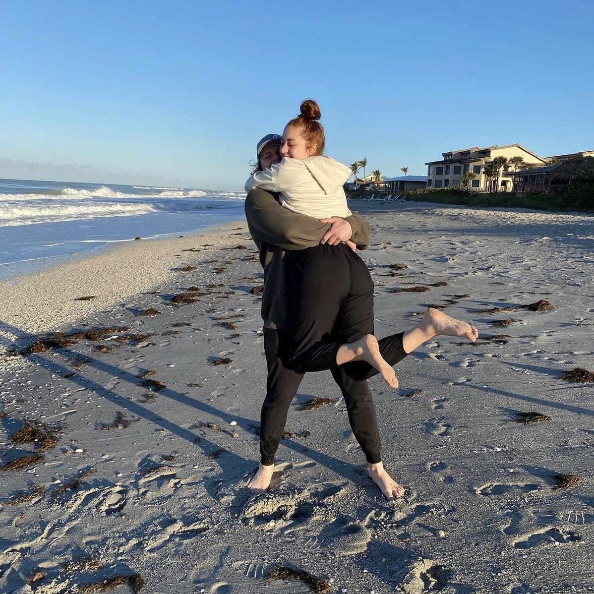 Endorphin high hug after a morning walk on the beach — FL 2023