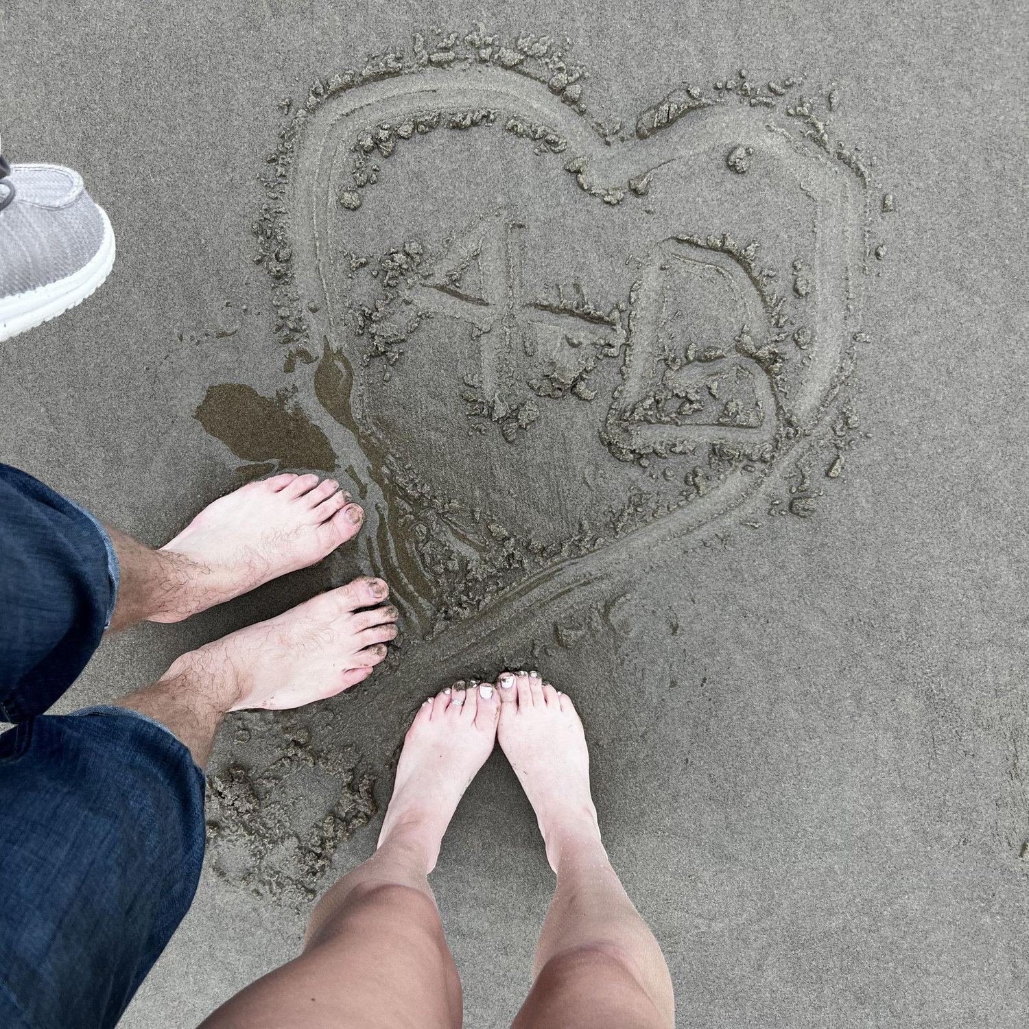 Initials in the sand on the West Coast