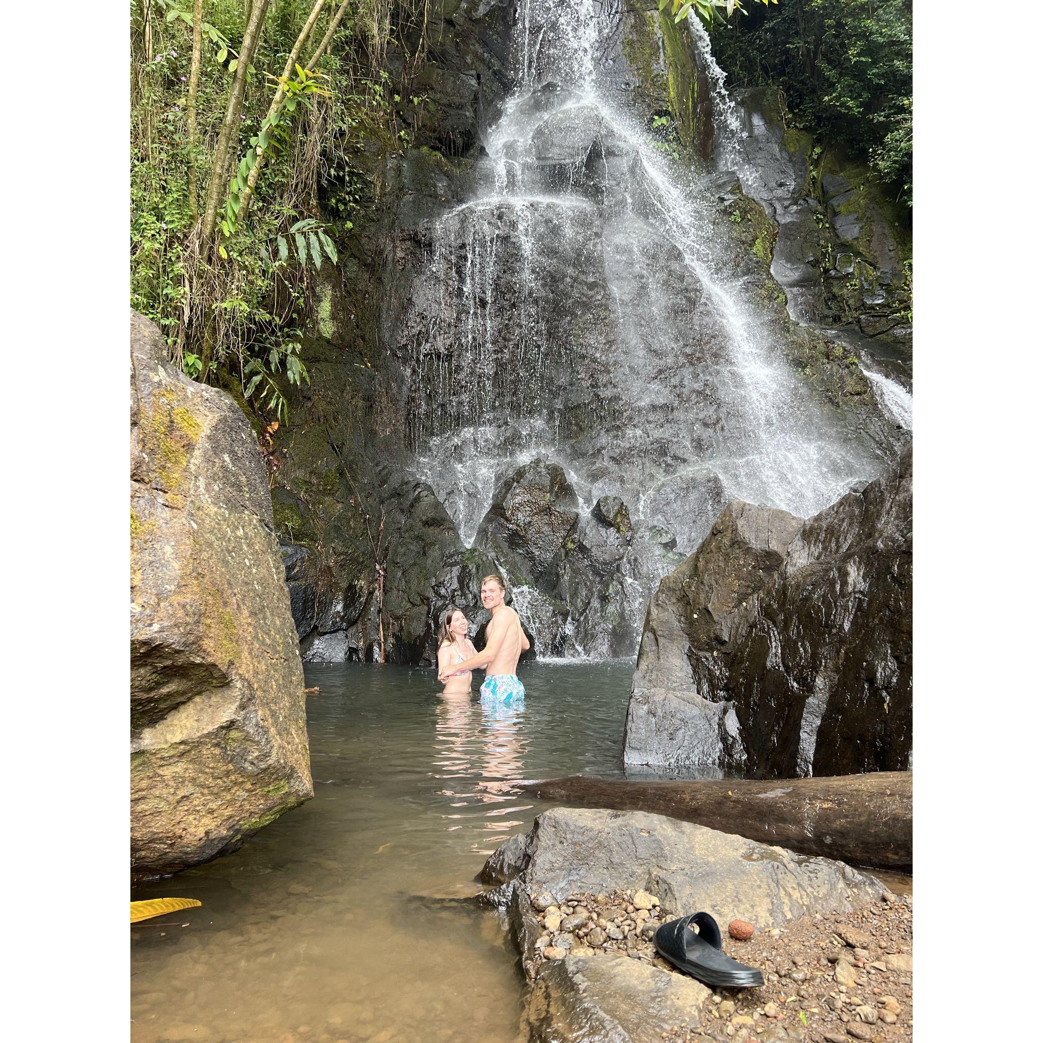 Taking a dip in a waterfall after a hike in Honolulu