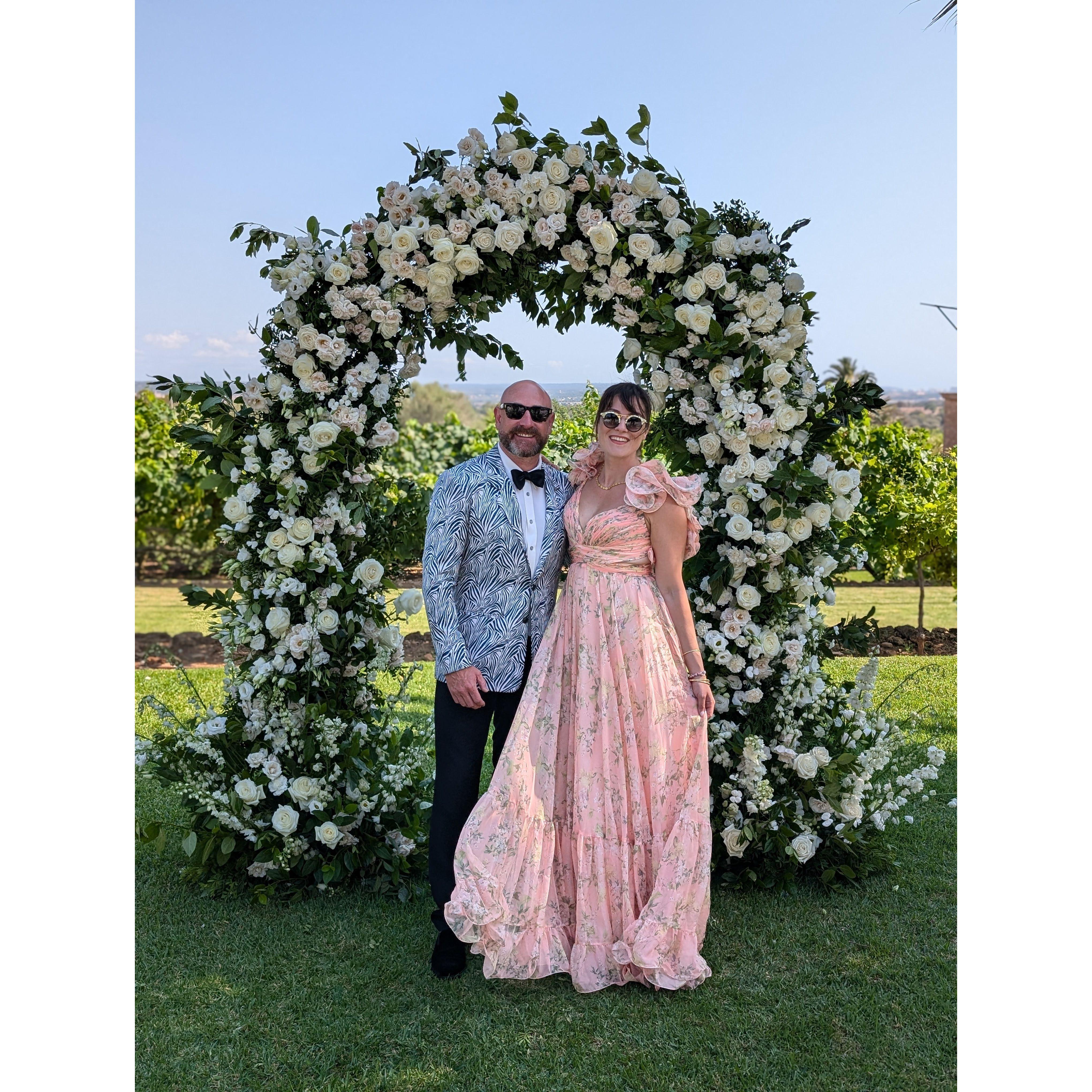 Posed in front of our friend's Wedding arch in Mallorca