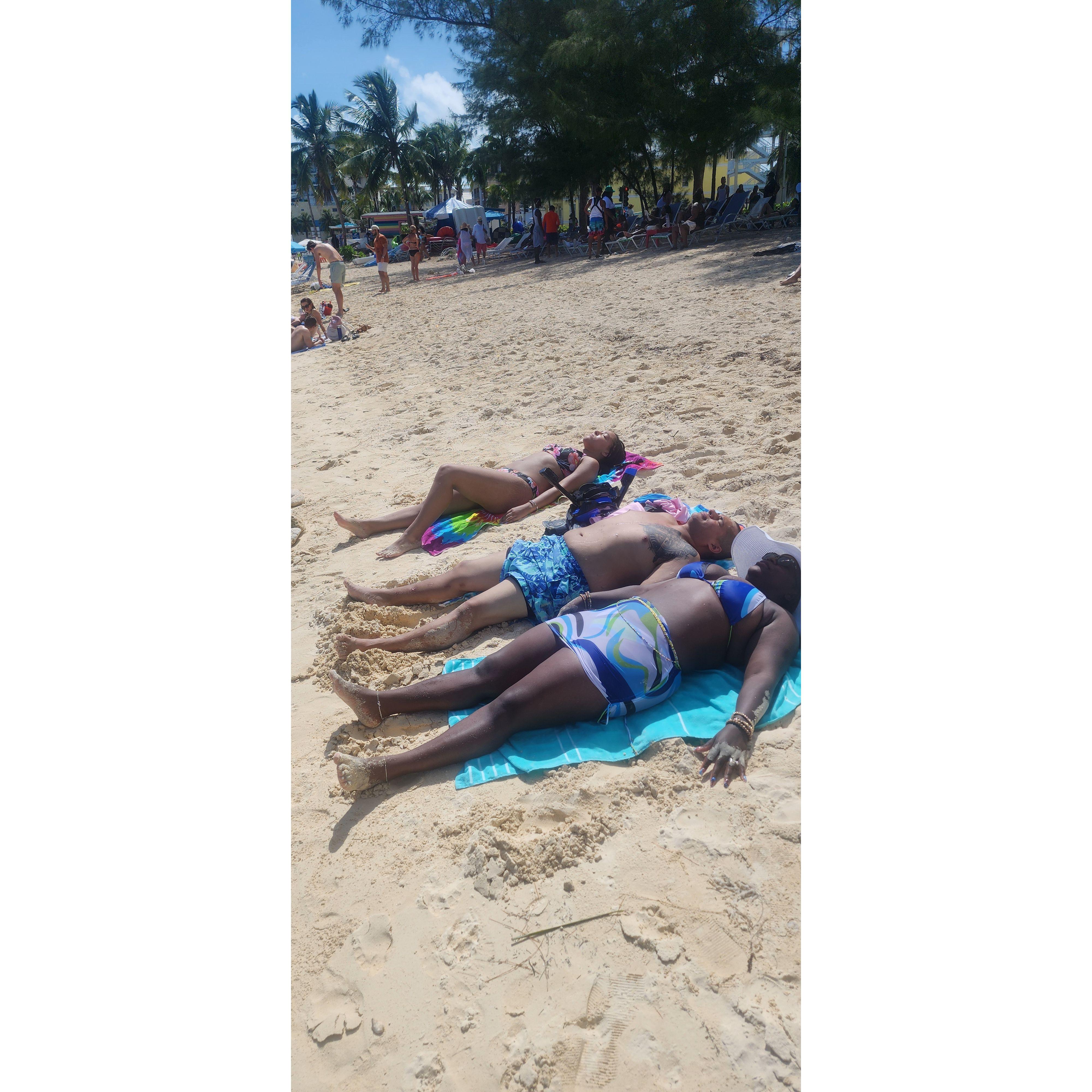 Soaking up the sun on the beach in the Bahamas.