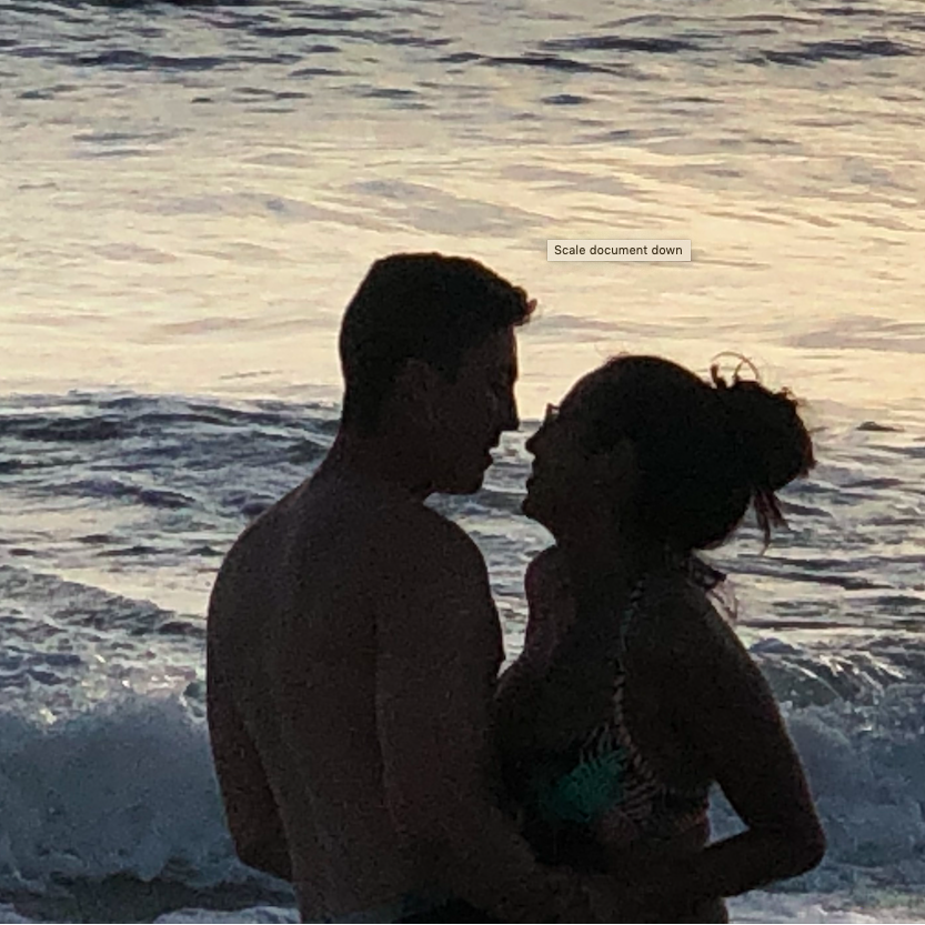 A random lady on the beach came up to us and asked to take our picture. We posed for it and she said, "No, you guys are clearly in love and that's what I want to capture." And so she did.