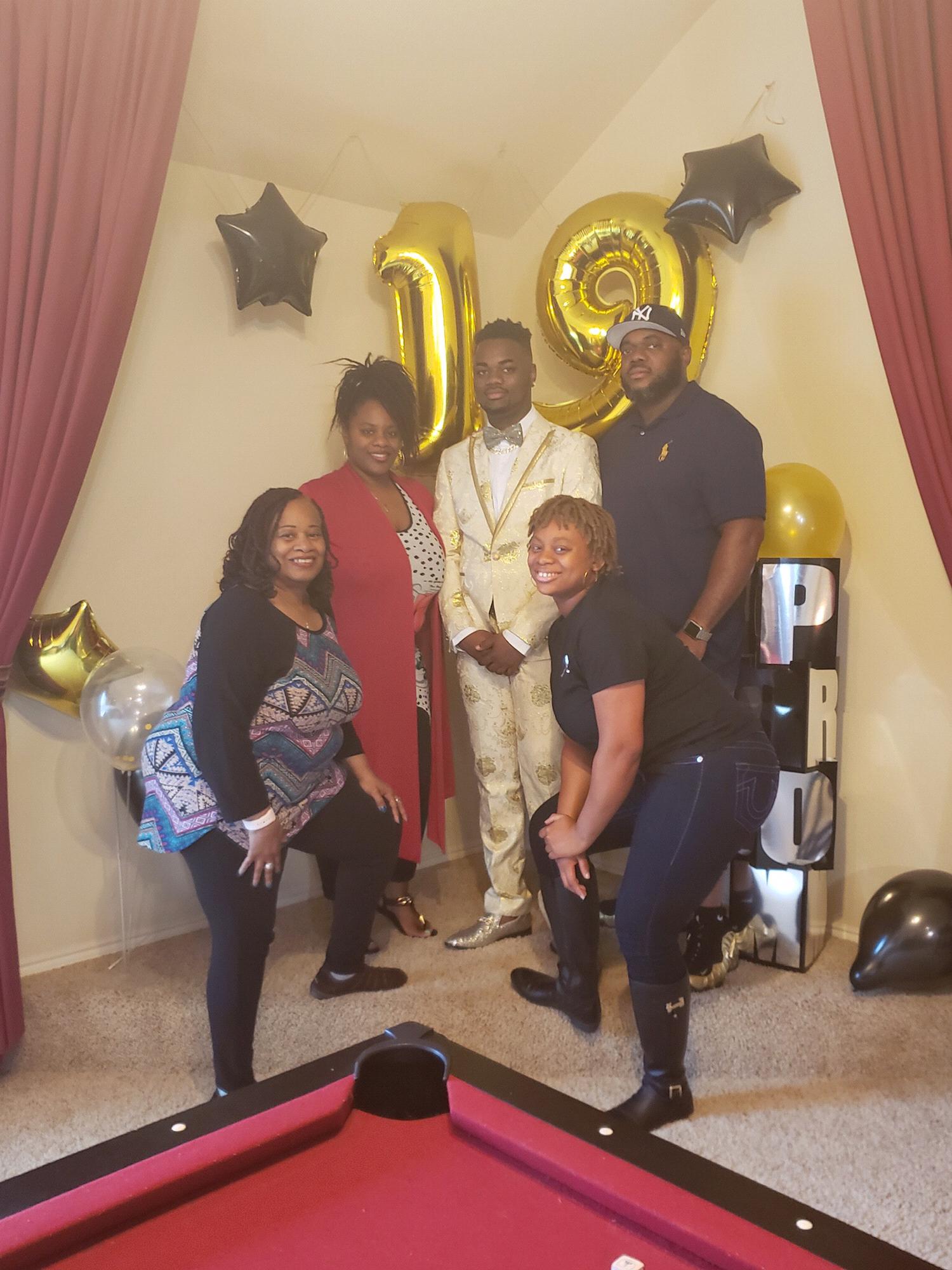 Kyla, grandma, mom, and dad at Lester’s prom send off